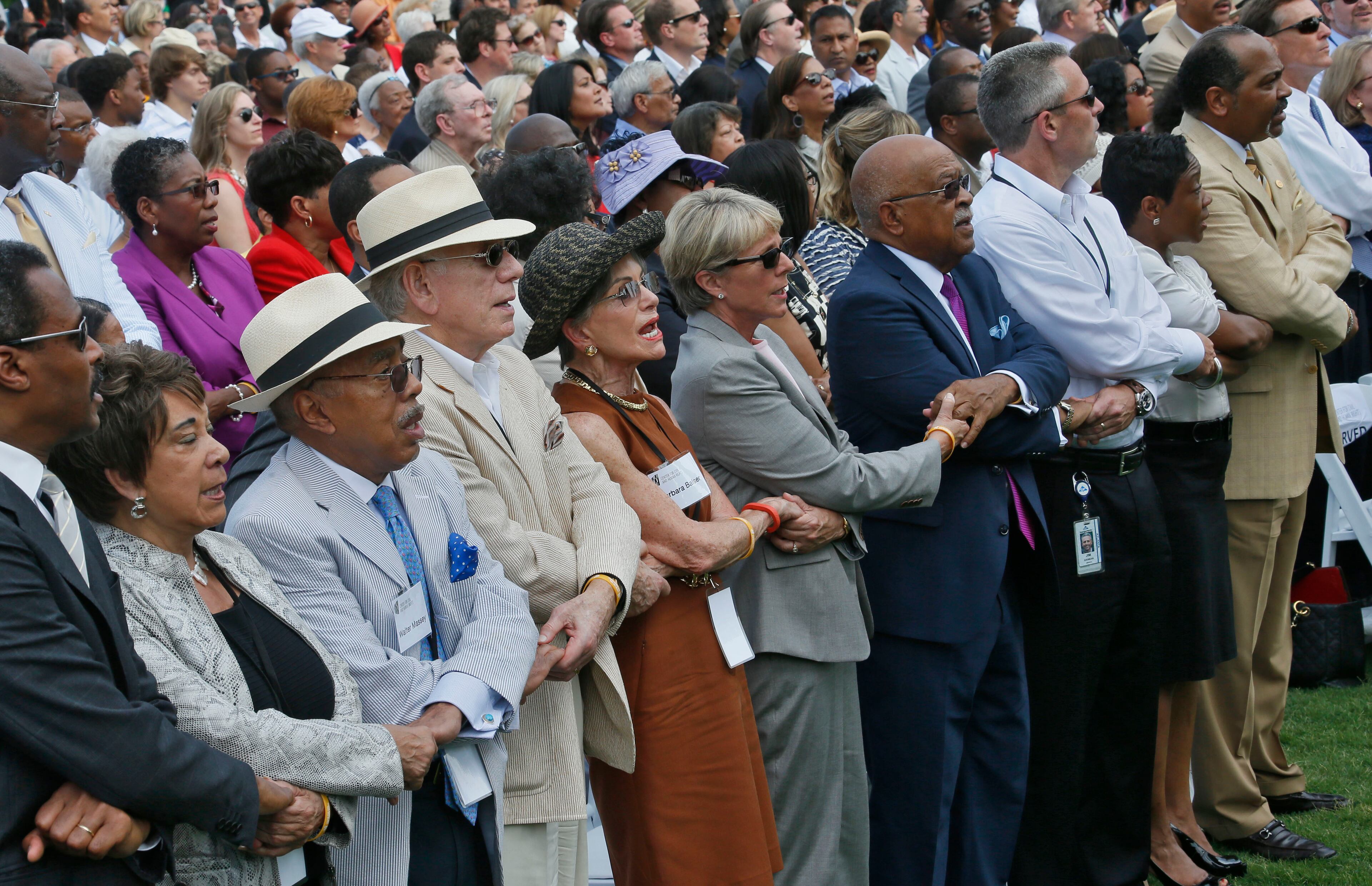 The Community Choir concluded the ceremony with an emotional performance of "We Shall Overcome", with participation of the audience. The National Center for Civil and Human Rights held its grand opening celebration with a 10 a.m. public ceremony outside in the plaza at Pemberton Place in advance of a noon opening. The ceremony included speeches, and a choir which concluded the ceremony with an emotional performance of "We Shall Overcome." BOB ANDRES / BANDRES@AJC.COM