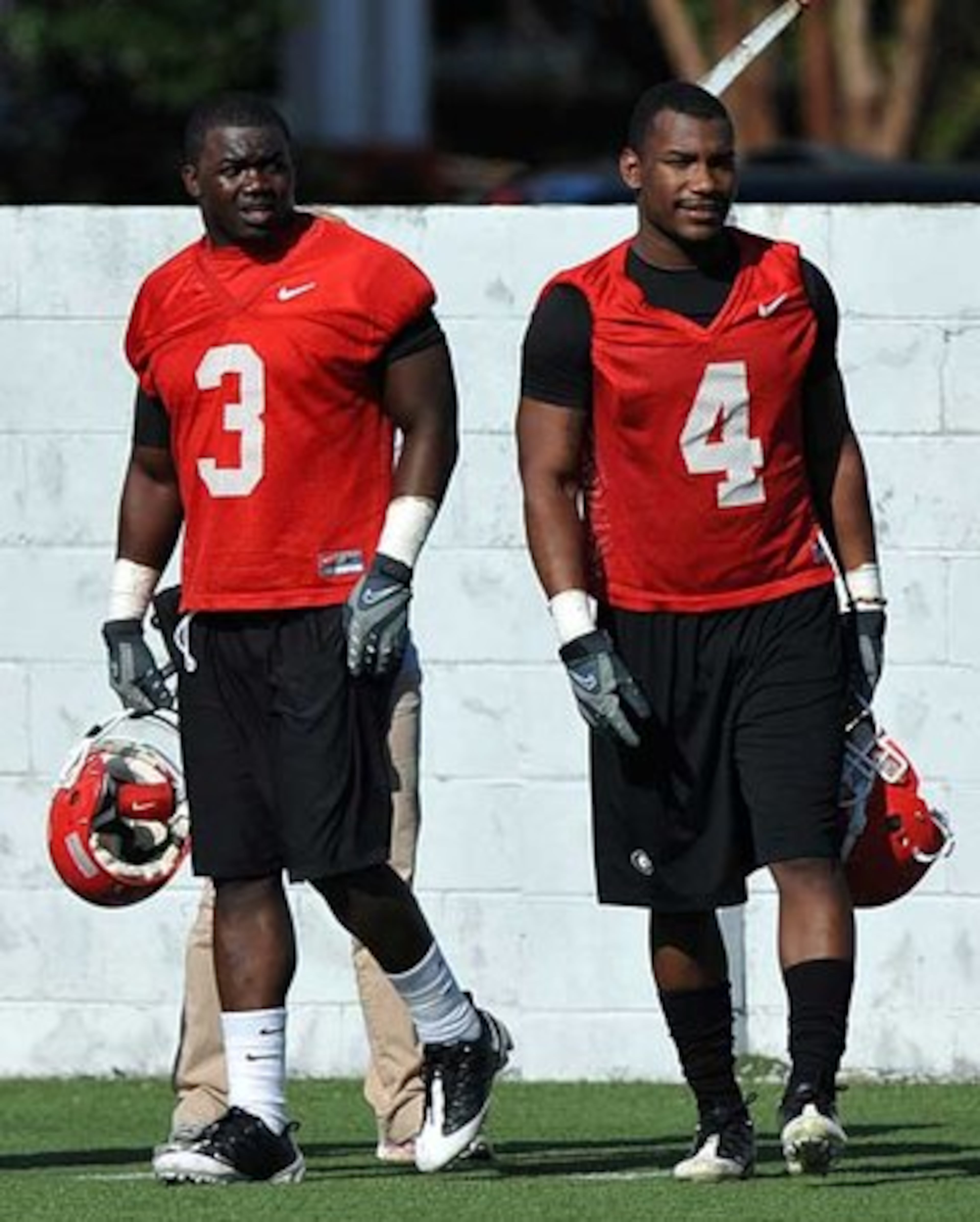 Ealey (left, with Caleb King) was suspended indefinitely from the team in February for missing an early-morning disciplinary run. He was reinstated in time for spring practice in March but was sidelined with a hamstring injury after only four practices and did not practice again. He was also suspended from last season's opener because of an arrest for hit-and-run of a parked vehicle and driving with a suspended license. - Chip Towers, AJC