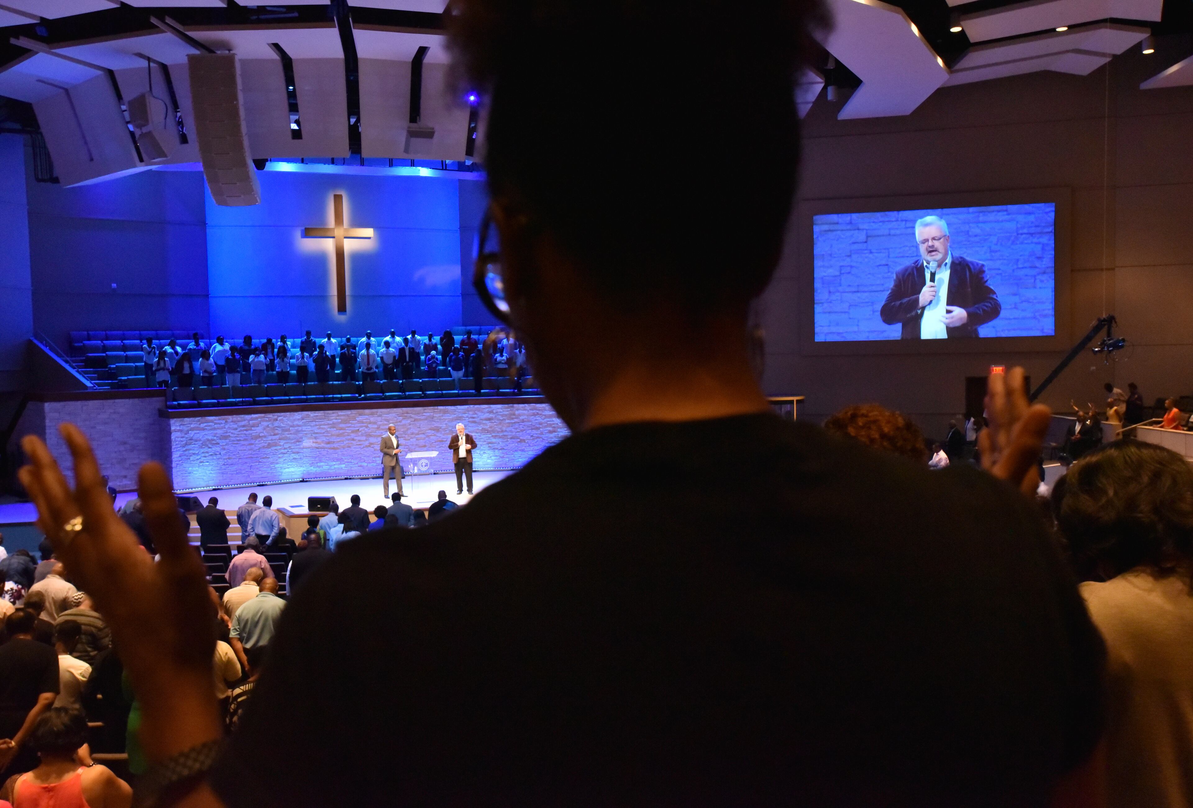July 10, 2016 Dallas, Texas - Church members join hands as they take part in a service at Concord Church in Dallas on Sunday, July 10, 2016. HYOSUB SHIN / HSHIN@AJC.COM