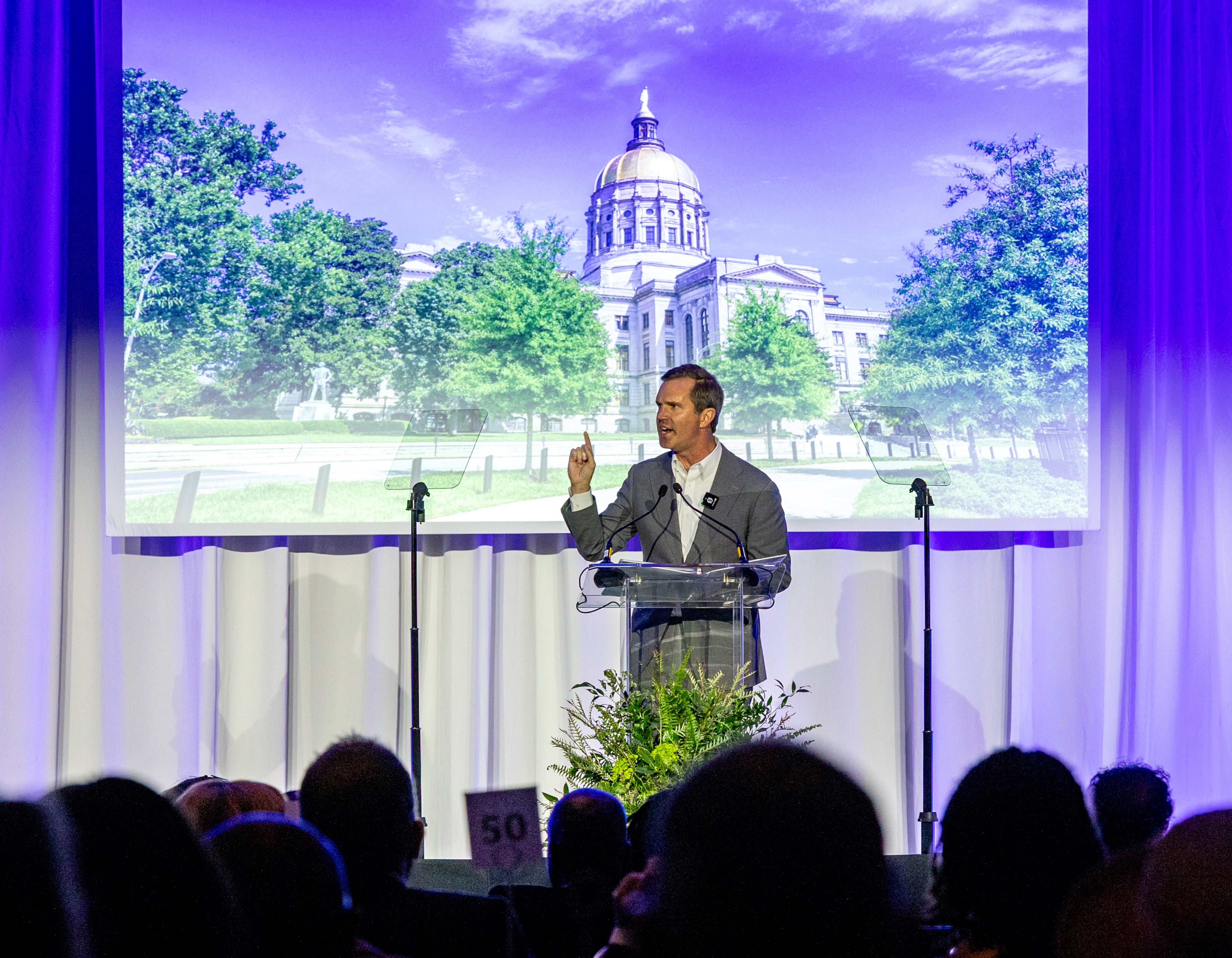 Kentucky Gov. Andy Beshear is the keynote speaker at the Carter-Lewis dinner at the Atlanta Marriott Marquis on Saturday, April 11, 2026. (Jenni Girtman for the AJC)