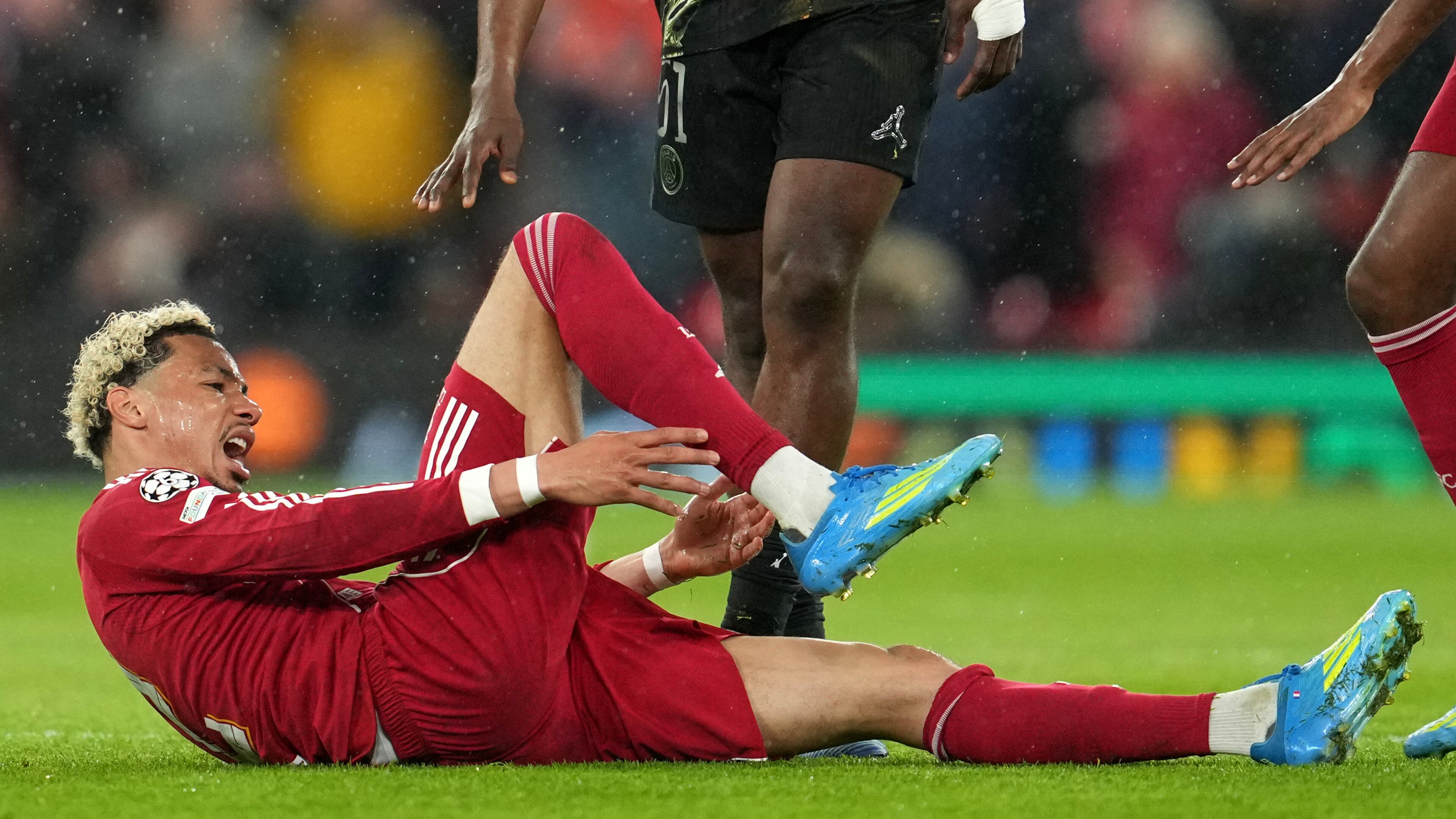 Liverpool's Hugo Ekitike reacts after getting injured during the Champions League quarterfinal second leg soccer match between Liverpool and Paris Saint-Germain in Liverpool, England, Tuesday, April 14, 2026. (AP Photo/Jon Super)