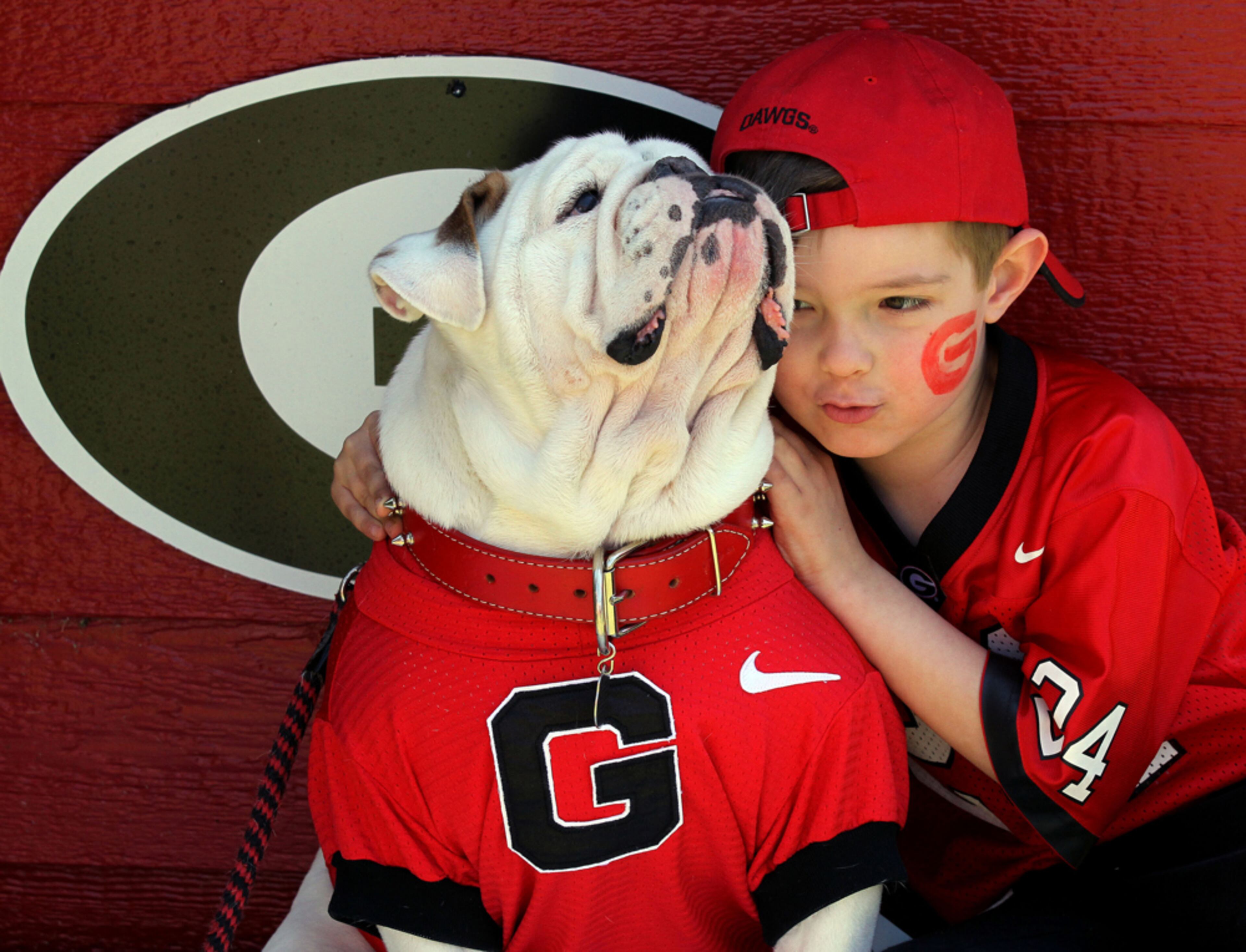 APRIL 6, 2012-ATLANTA: Jones Kendall, age 6, poses with UGA IX before UGA's G-Day football game at Sanford Stadium in Athens on Saturday April 6th, 2013. The Black team beat the Red 23 to 17. PHIL SKINNER / PSKINNER@AJC.COM editor's note: CQ