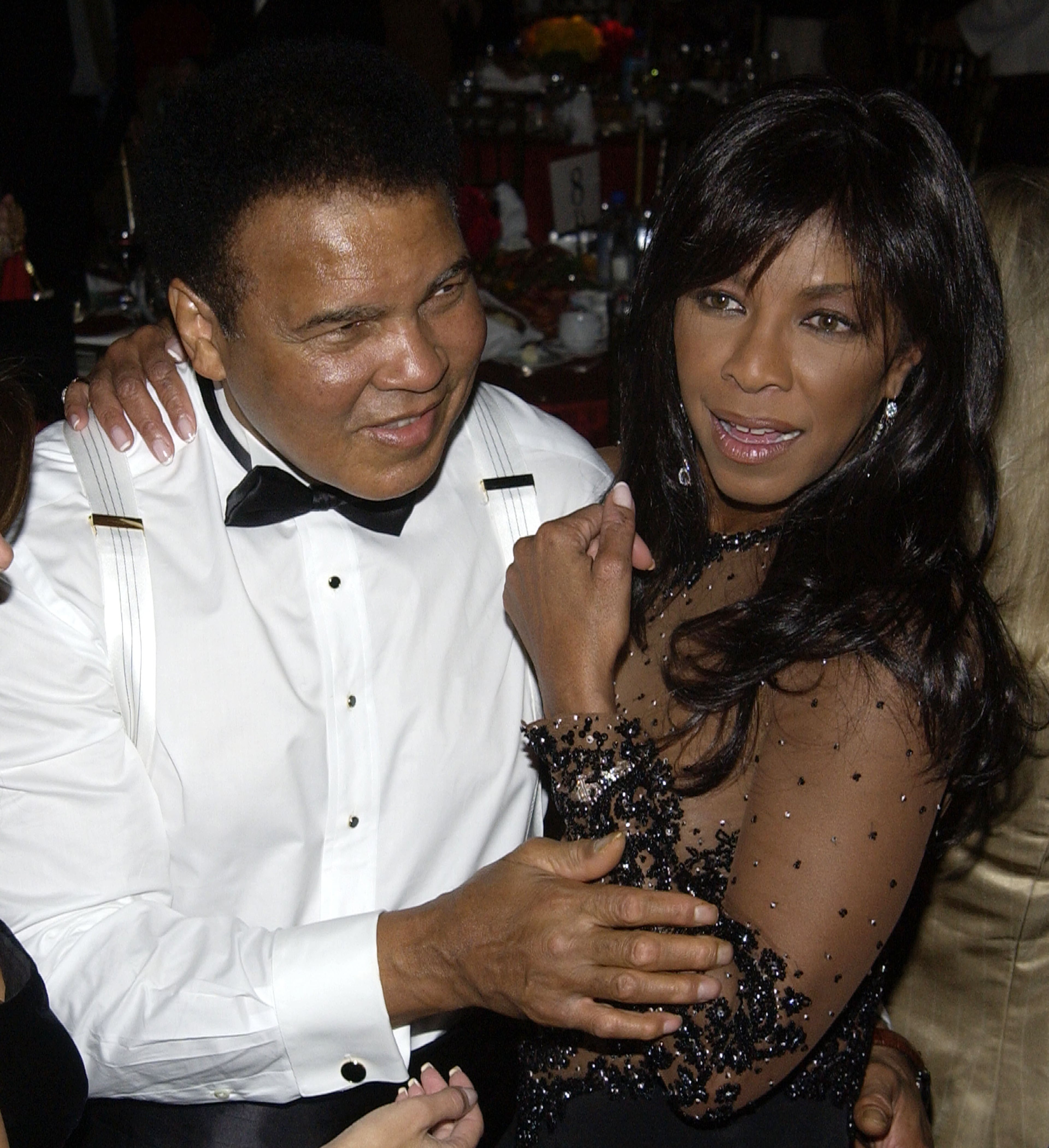 Former heavyweight boxing champion Muhammad Ali and singer Natalie Cole attend the Time To Give Gala benefiting the Afghanistan World Foundation and honouring Ali with the Freedom Award on December 2, 2003 in Los Angeles, California. (Photo by Vince Bucci/Getty Images)