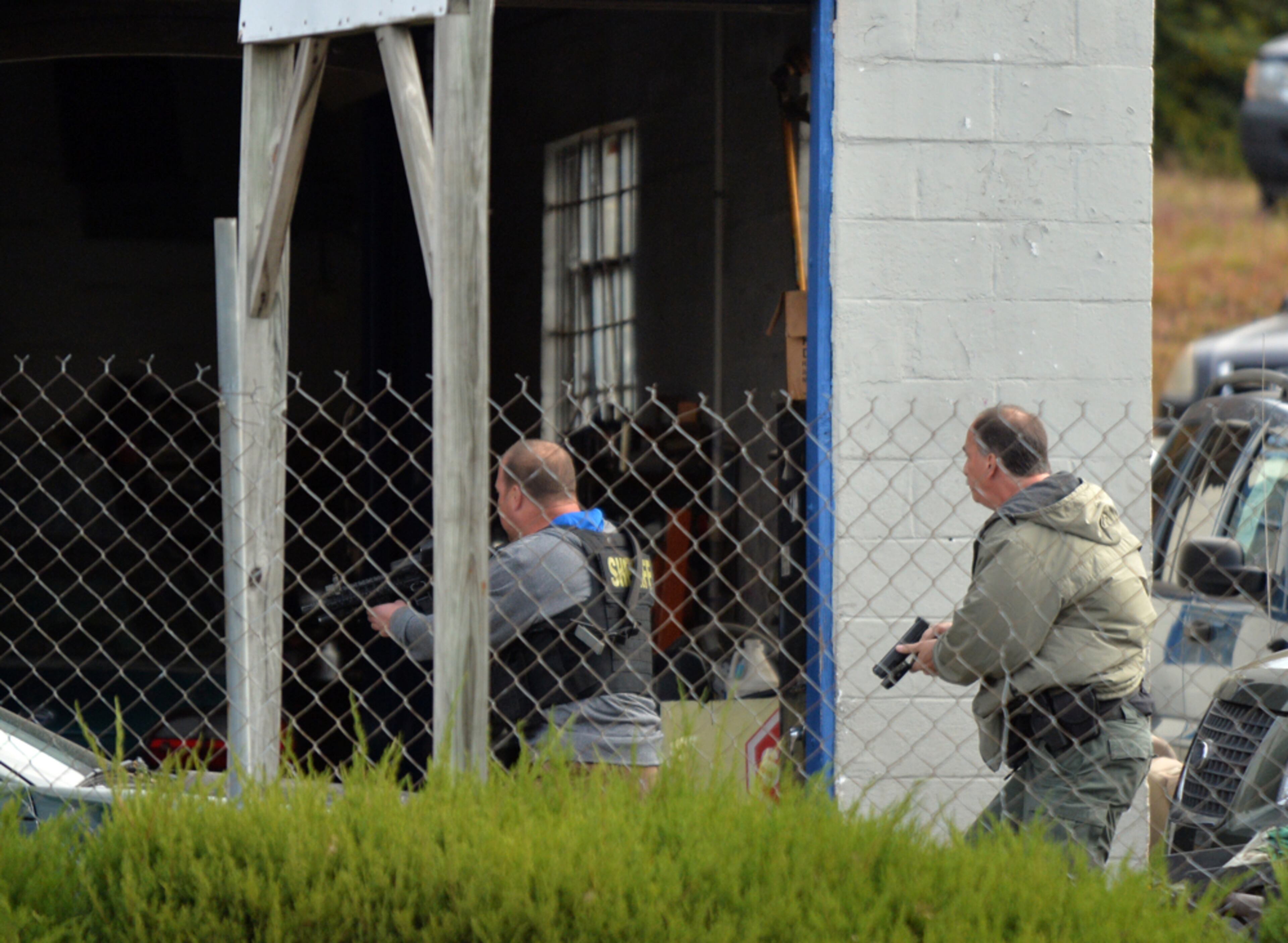 USED CAR LOT RAIDED--November 13, 2014 Atlanta: Law enforcement raid a used car lot in Forest Park Thursday November 13, 2014. John Emomwen Egbe, owner of JD's Auto Sales was taken into custody following the raid. Officials say the dealership rolled back the odometers on used cars and sold to consumers. They also expect vehicle cloning, a process of replacing the VIN number of one car with that of a stolen car. BRANT SANDERLIN / BSANDERLIN@AJC.COM