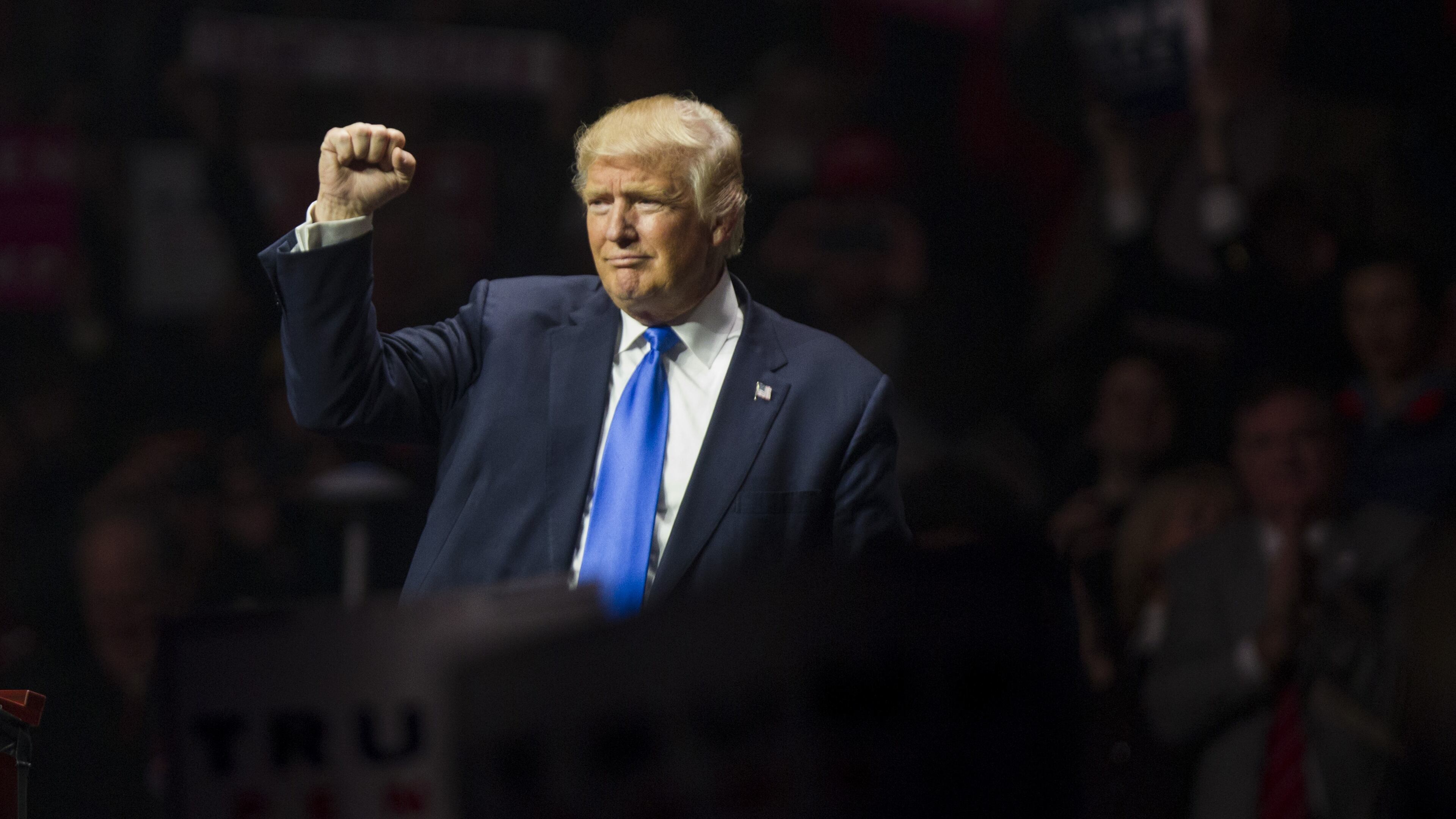 Republican presidential candidate Donald Trump makes a fist at the end of his rally at the SNHU Arena on November 7, 2016 in Manchester, N.H.