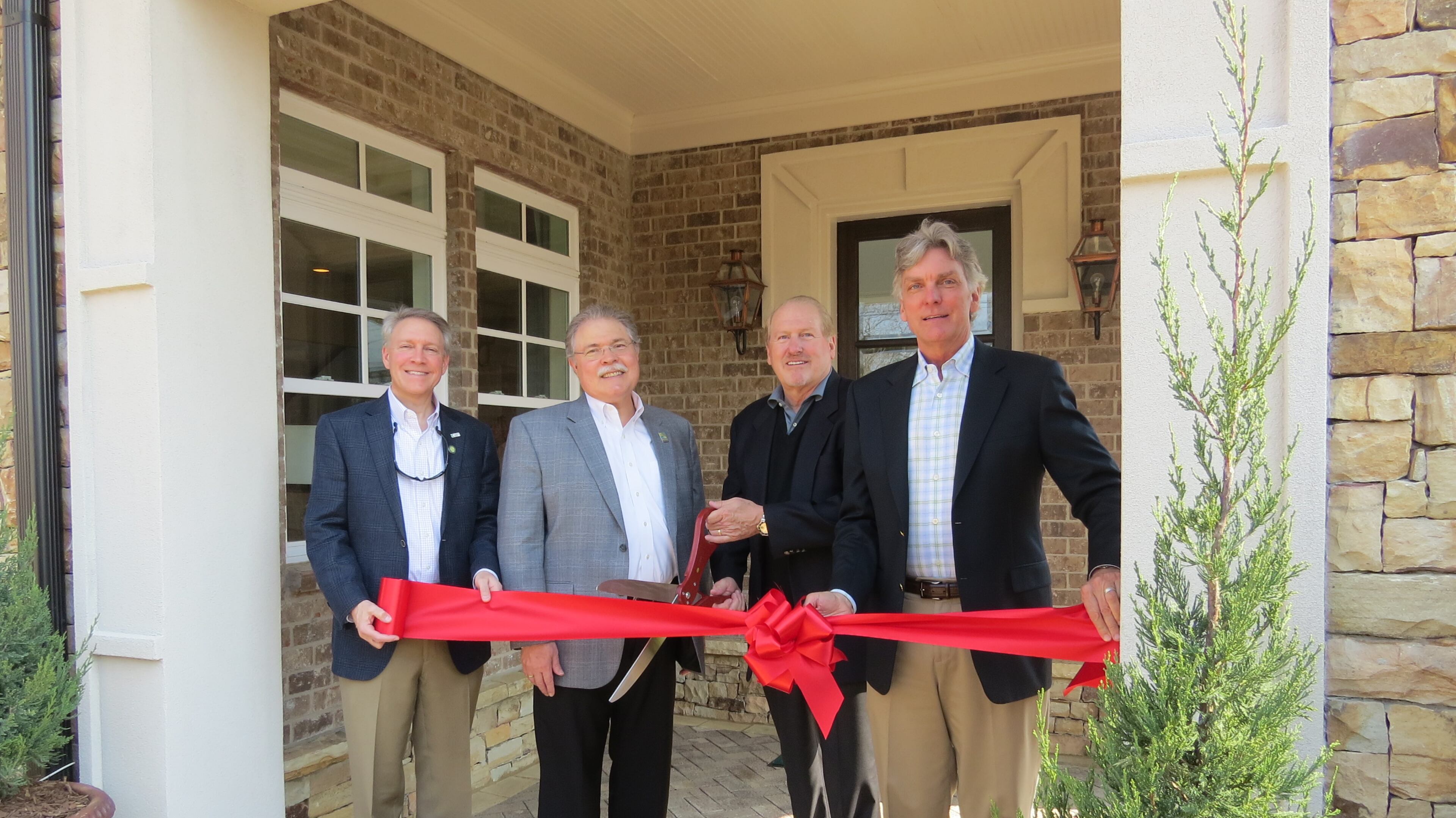 Councilmember Weare Gratwick, (Post 6), Mayor Mike Mason and Peachtree Residential Properties CEO, Dave Borreson, and Alex Rickenbacker, President, at the opening of the Oglethorpe, single-family home community on Spalding Drive in Peachtree Corners. Courtesy City of Peachtree Corners