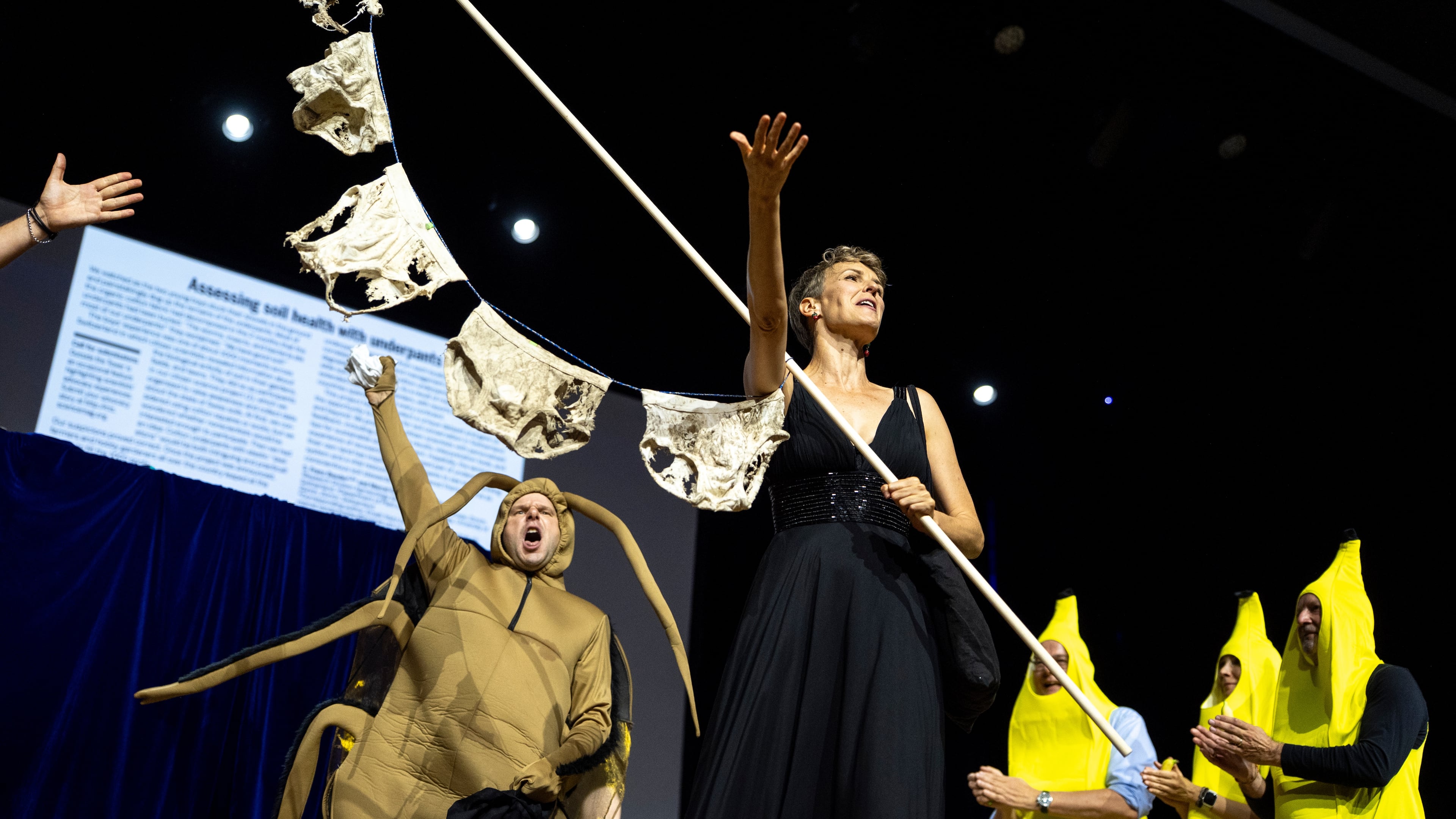 Soil Science Prize Winners Pia Viviani, right, and Atlant Bieri, left, on the stage during the Ig Nobel Prize ceremony held in the Zurich Convention Center in Zurich, Switzerland, on Thursday, Sept. 3, 2026. (Claudio Thoma/Keystone via AP)