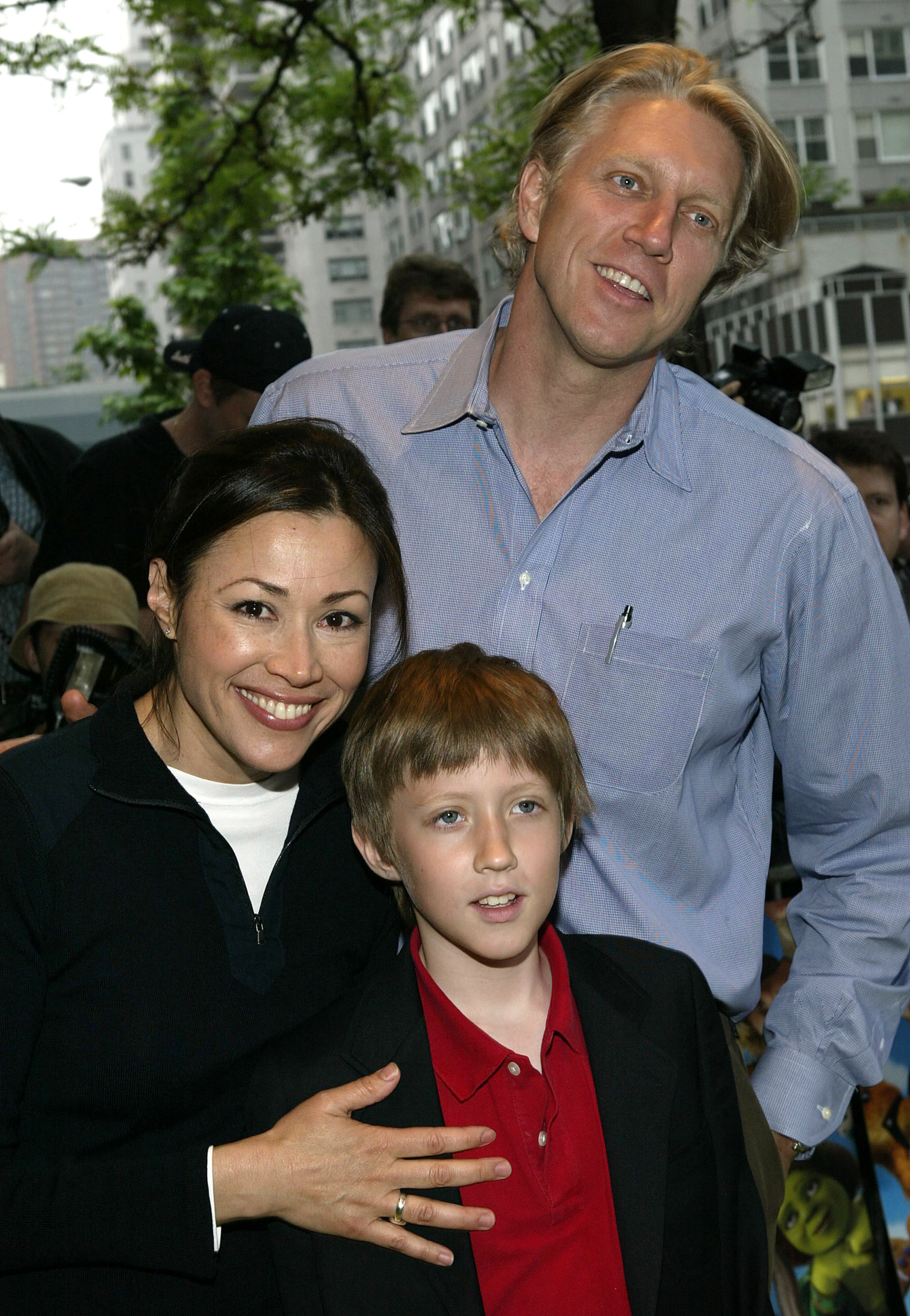 NBC "Today" show anchor Ann Curry with her husband Brian Ross and son Walker attend the screening of "Shrek2" at the Beekman Theatre May 17, 2004 in New York City.
