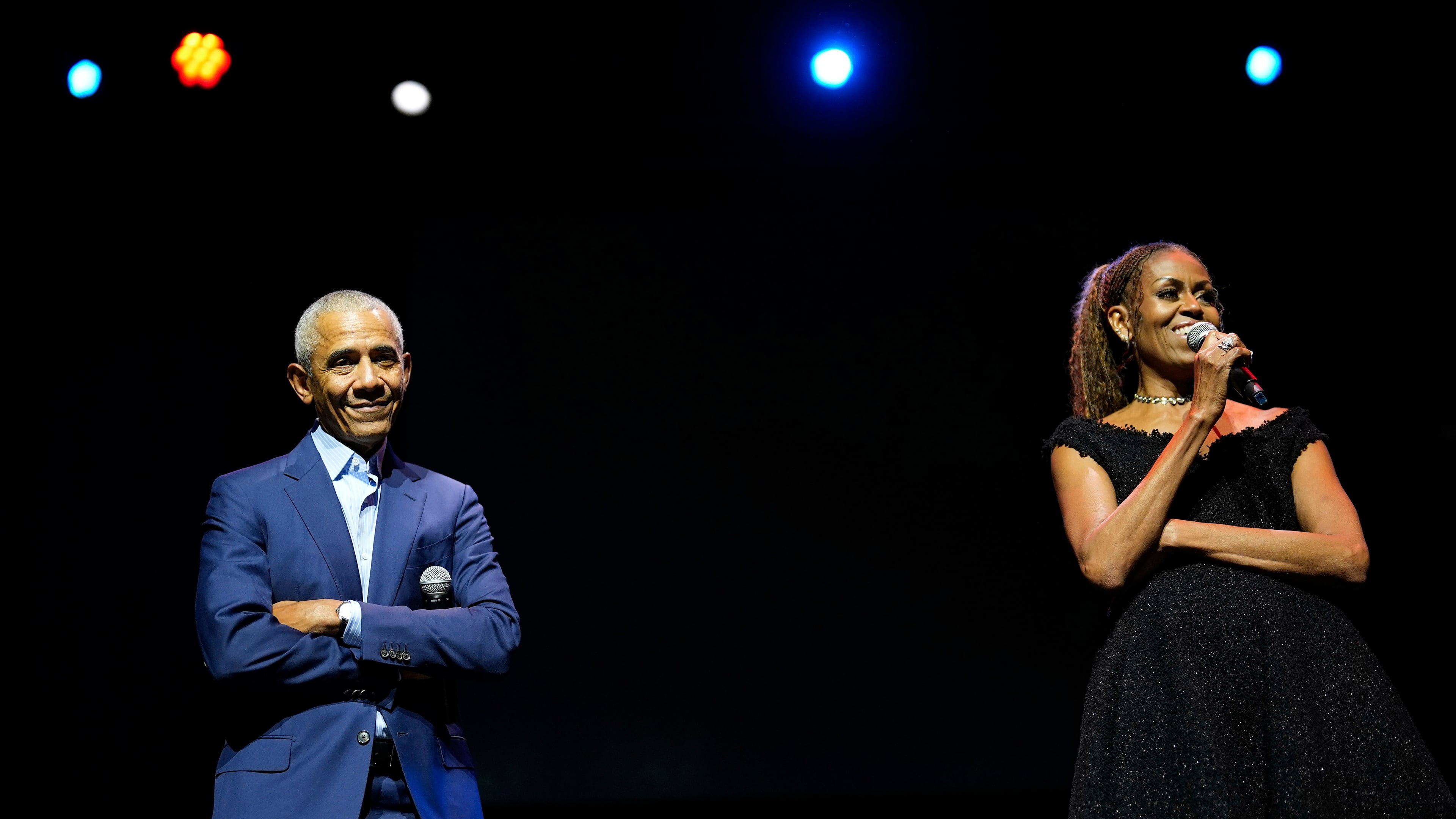 Former President Barack Obama and former first lady Michelle Obama on stage as they surprised administration and campaign alumni in Chicago at the ahead of the dedication ceremony of the Obama Presidential Center, Wednesday, June 17, 2026. (AP Photo/Pablo Martinez Monsivais, Pool)