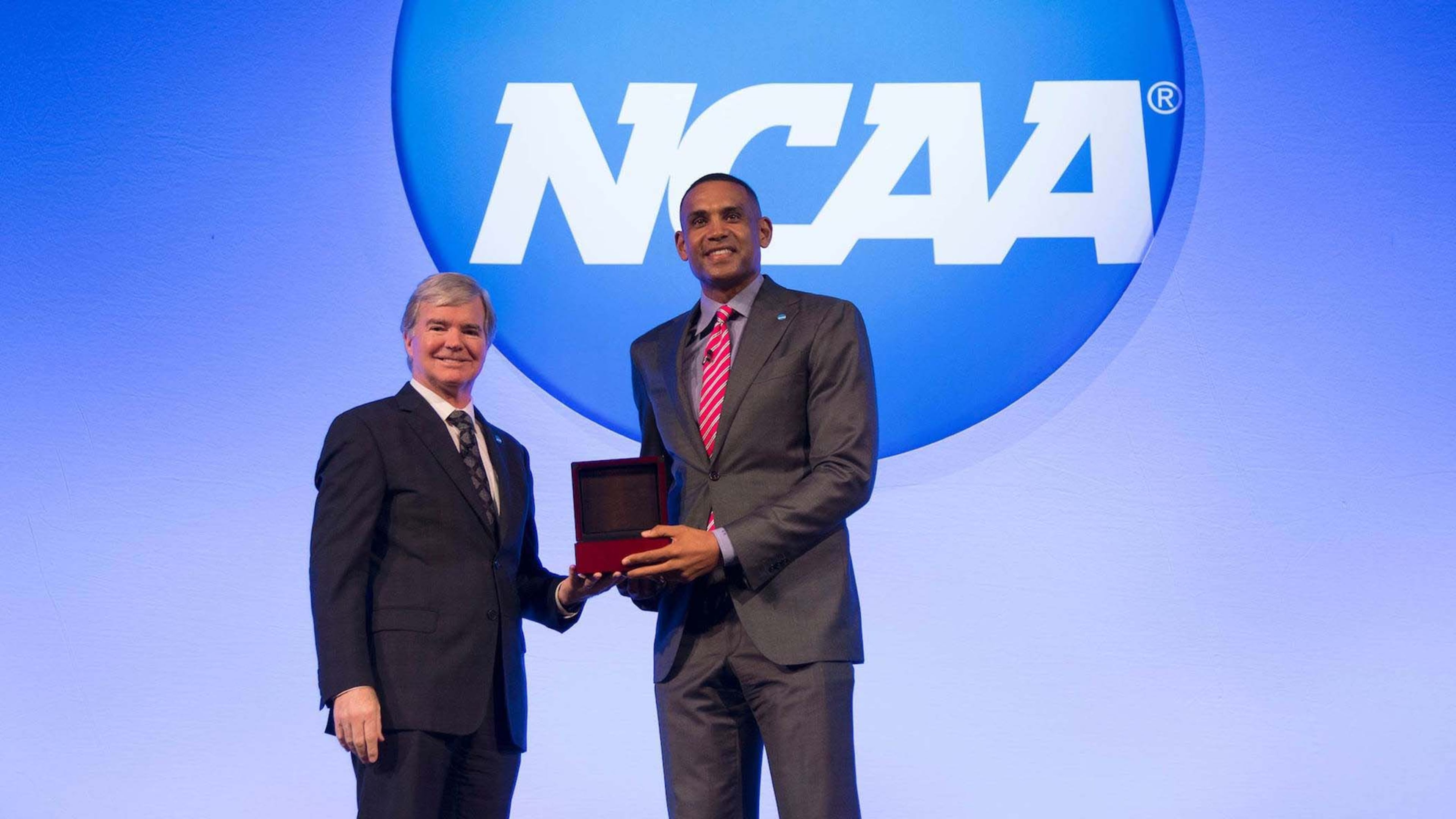 NCAA President Mark Emmert presents Hawks co-owner Grant Hill with the 2017 NCAA President’s Gerald R. Ford Award last month in Nashville.