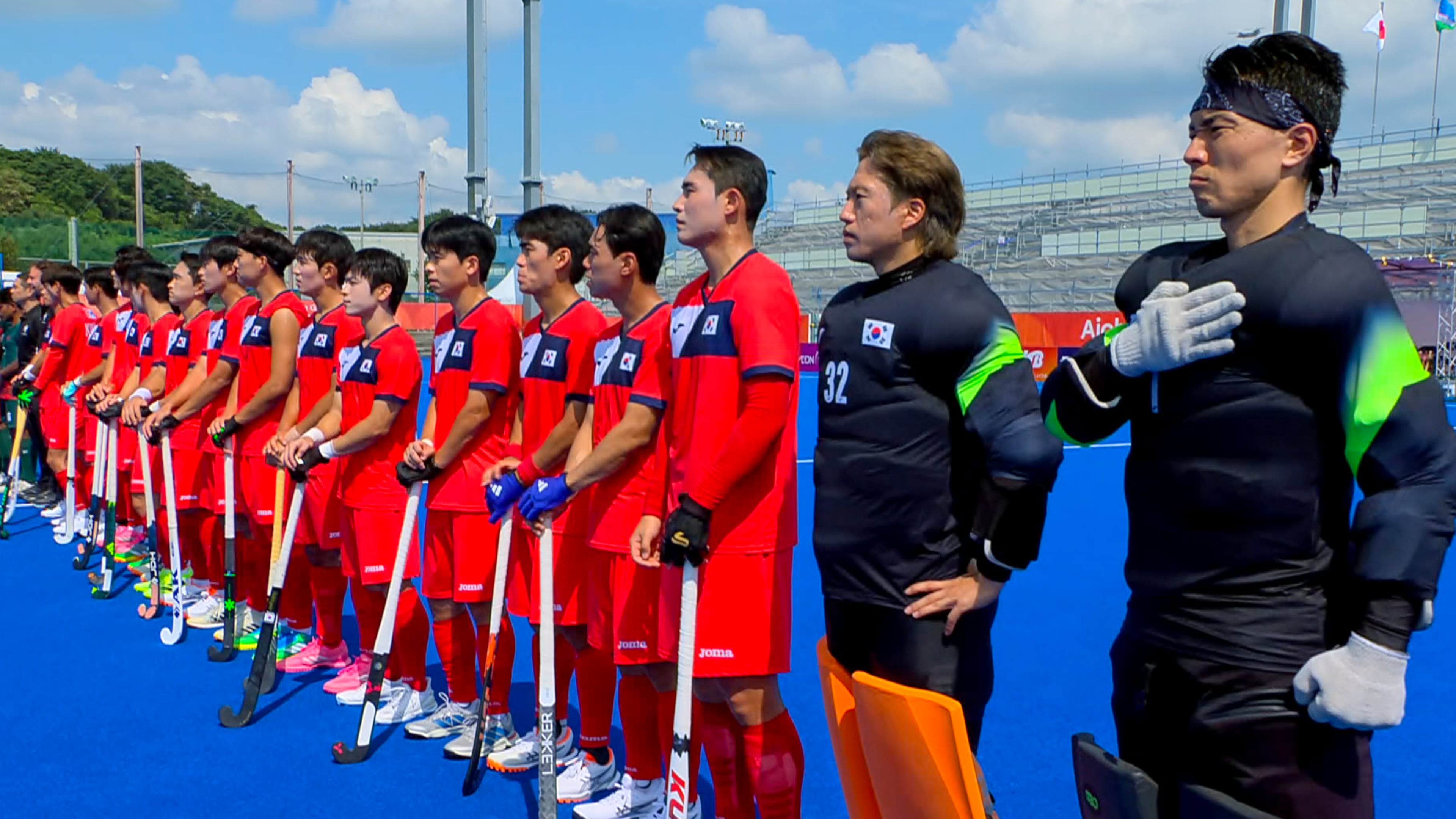 In this image made from video, South Korean men's field hockey players react as the North Korean national anthem is played ahead of their game against Bangladesh at the Asian Games in Kakamigahara city, Gifu prefecture, Japan, Friday, Sept. 18, 2026. (OCA/SNTV via AP)