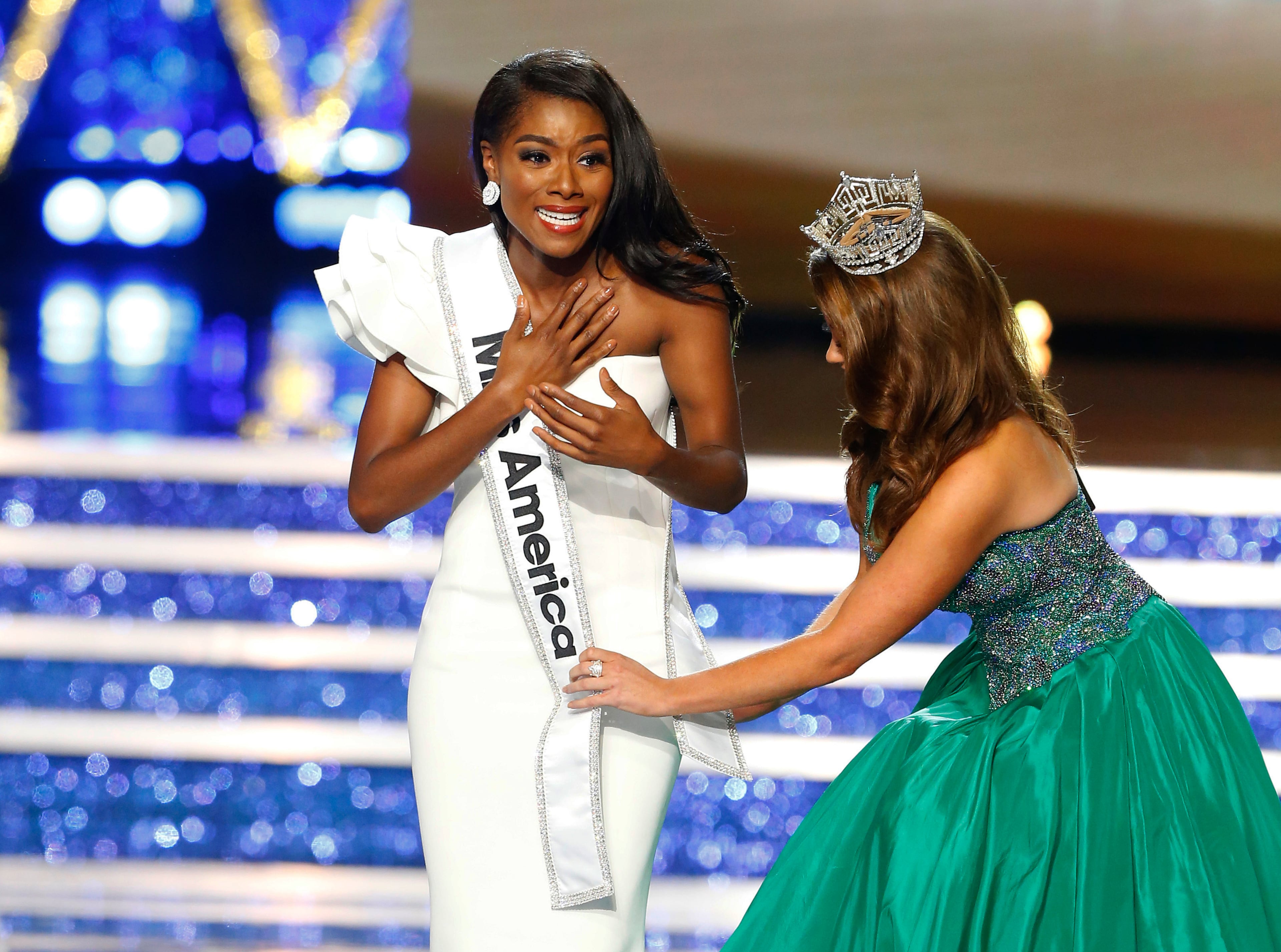 Miss New York Nia Franklin reacts after being named Miss America 2019, as she is crowned by last year's winner Cara Mund, Sunday, Sept. 9, 2018, in Atlantic City, N.J. (AP Photo/Noah K. Murray)