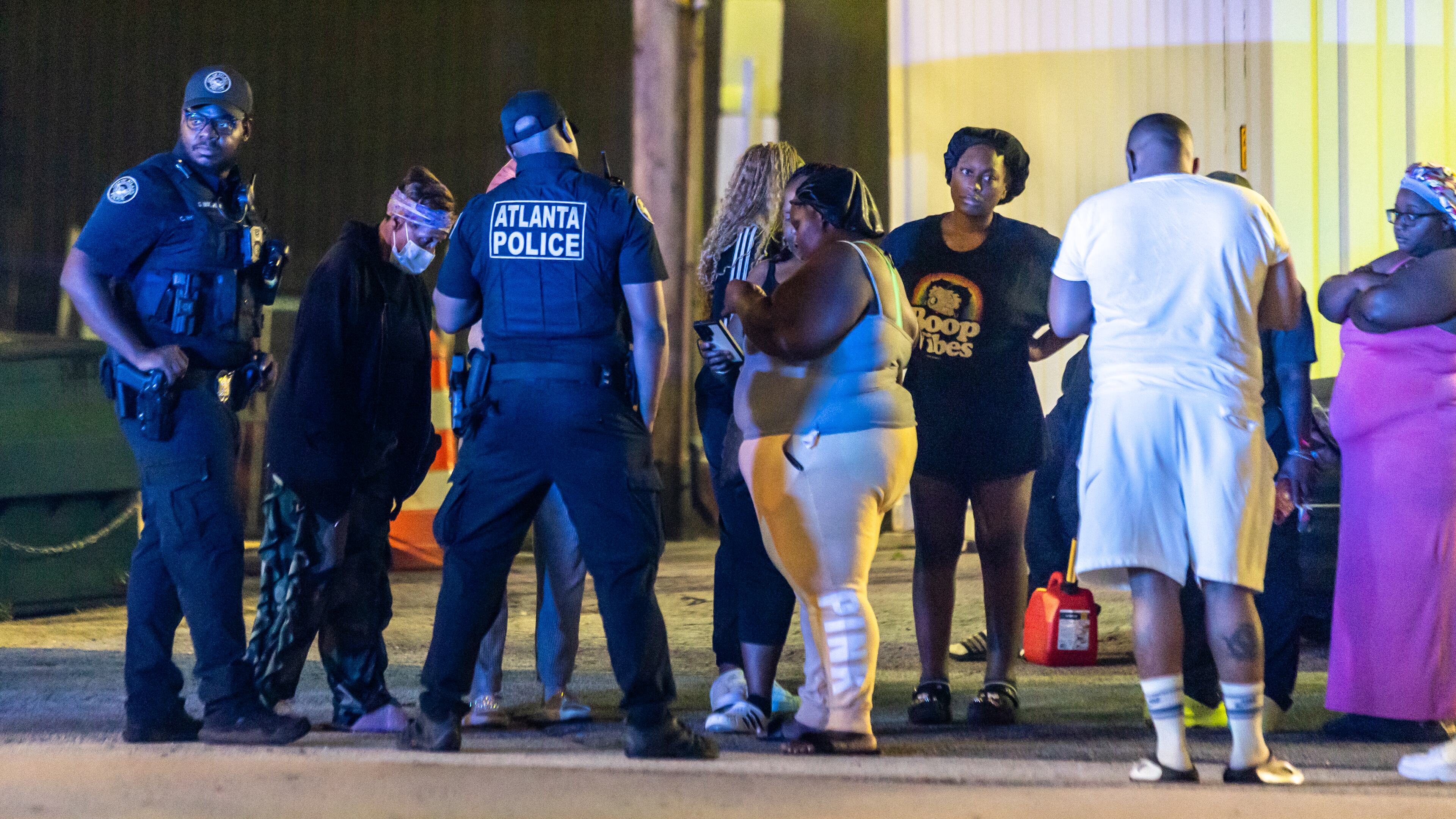 Family members and friends grieved at the scene where Atlanta police responded to a fatal stabbing on Ted Turner Drive on Thursday.