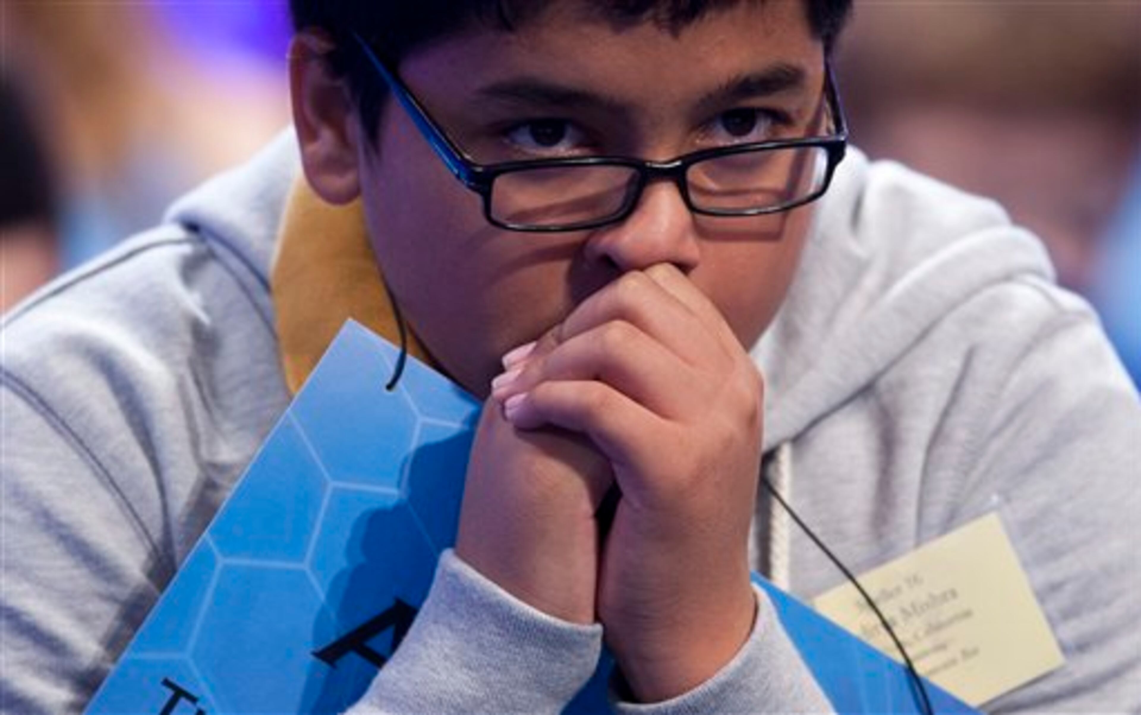 Aditya Mishra of Lincoln, Calif. waits for his turn during the third round of the National Spelling Bee, Wednesday, May 29, 2013, in Oxon Hill, Md. (AP Photo/Evan Vucci)