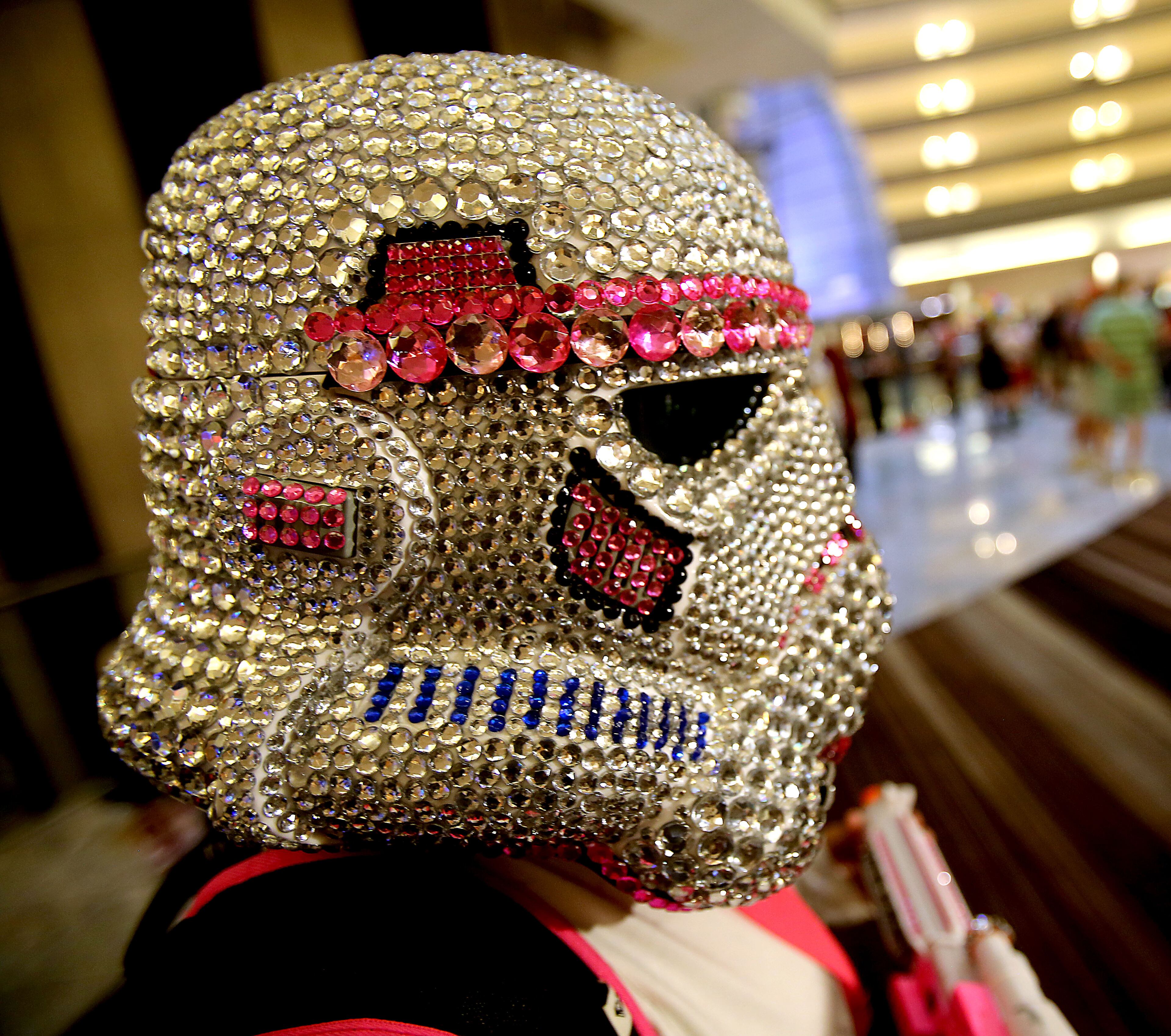 September 1, 2017 Atlanta - Bobbie Crotts, of Cumming, tricked out her Storm Trooper helmet with the right amount of bling. Dragon Con 2017 is in full fledge in its 31st year. With over 80,000 people expected to fill the streets of downtown Atlanta, the three-day event has always brought the best out of attendees and their costume-making abilities. RYON HORNE/RHORNE@AJC.COM