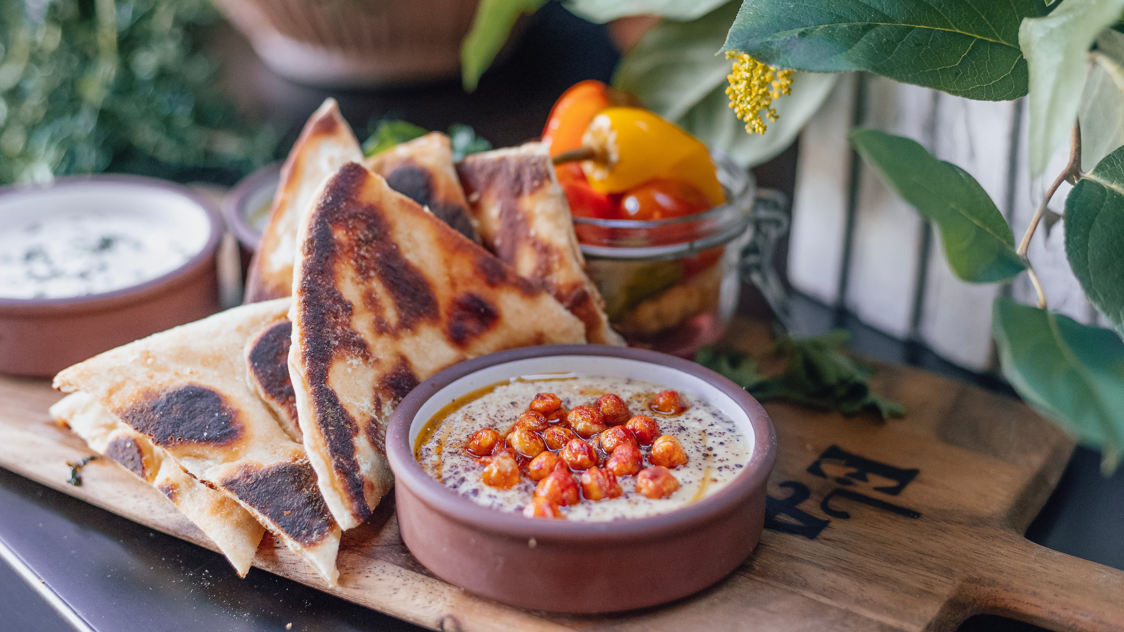 Ela offers three hummus options, including this one featuring crispy chickpeas and sumac. The trio also is available as a $15 sampler, with grilled pita. Courtesy of Frankie Cole