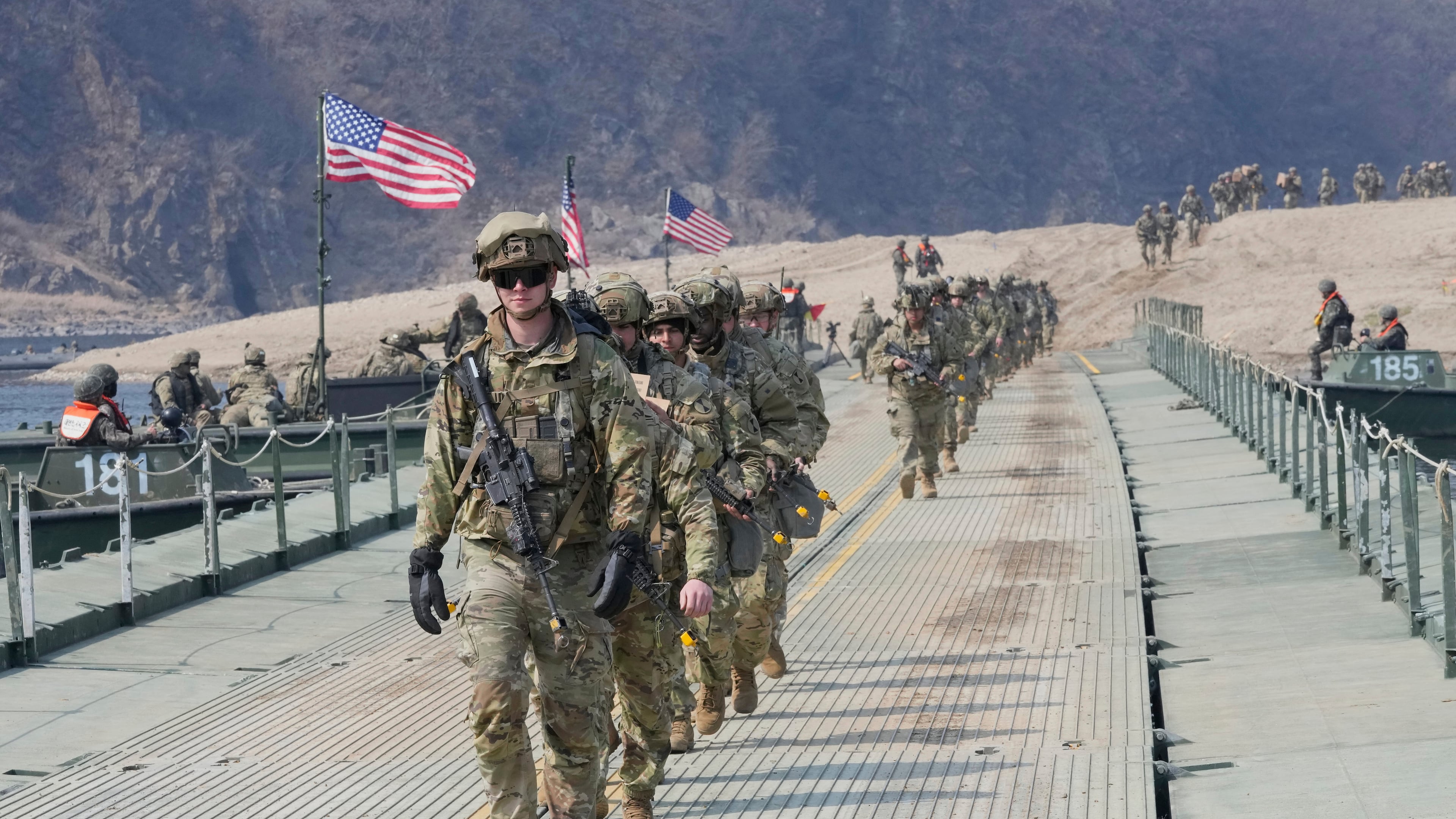 FILE - U.S. Army soldiers cross a floating bridge on the Imjin River during a joint river-crossing exercise between South Korea and the United States as a part of the Freedom Shield military exercise in Yeoncheon, South Korea, March 20, 2025. (AP Photo/Ahn Young-joon, File)