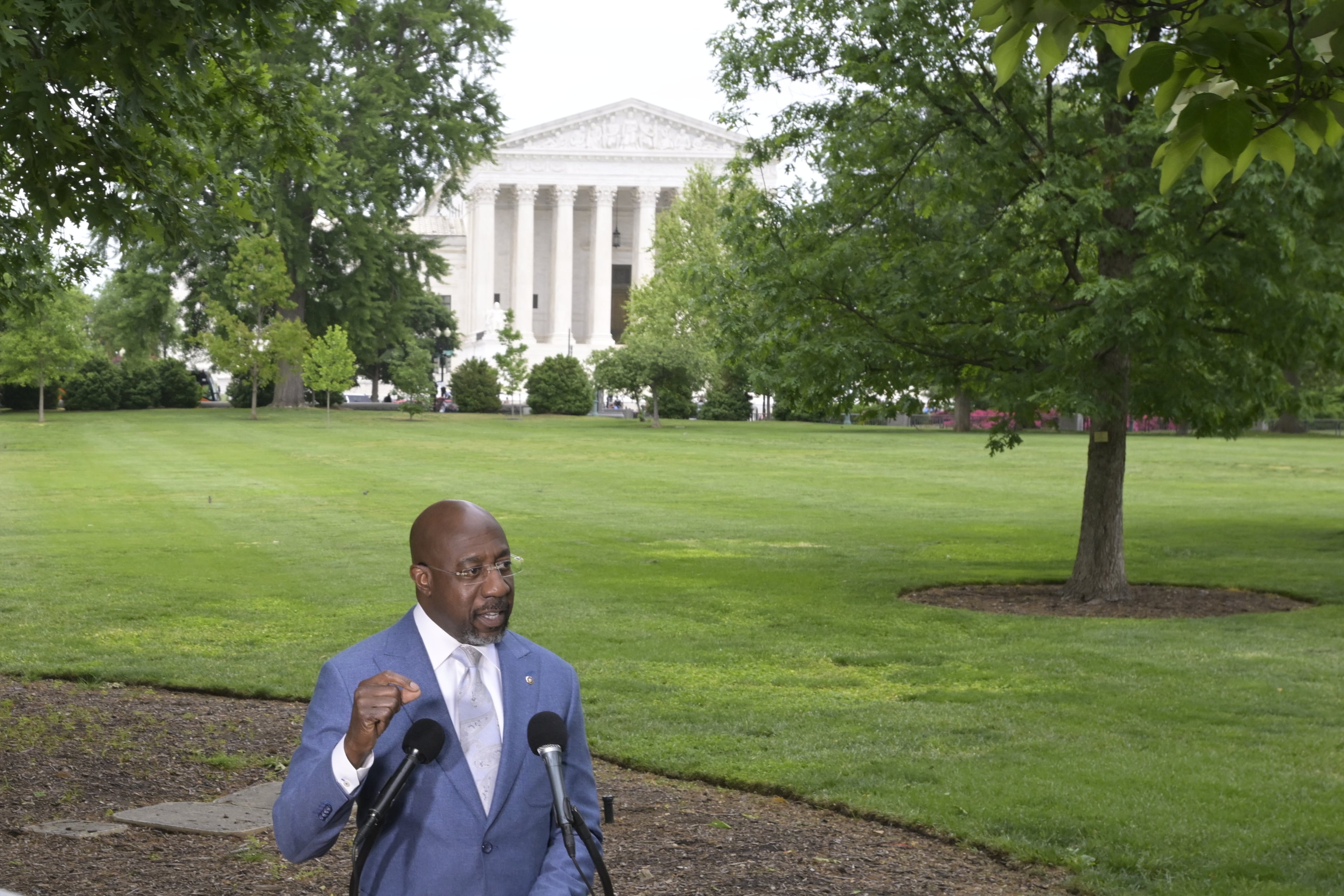 Sen. Raphael Warnock holds a news conference in Washington on Wednesday regarding the Supreme Court's ruling that weakened the Voting Rights Act. (Rod Lamkey Jr./AP)