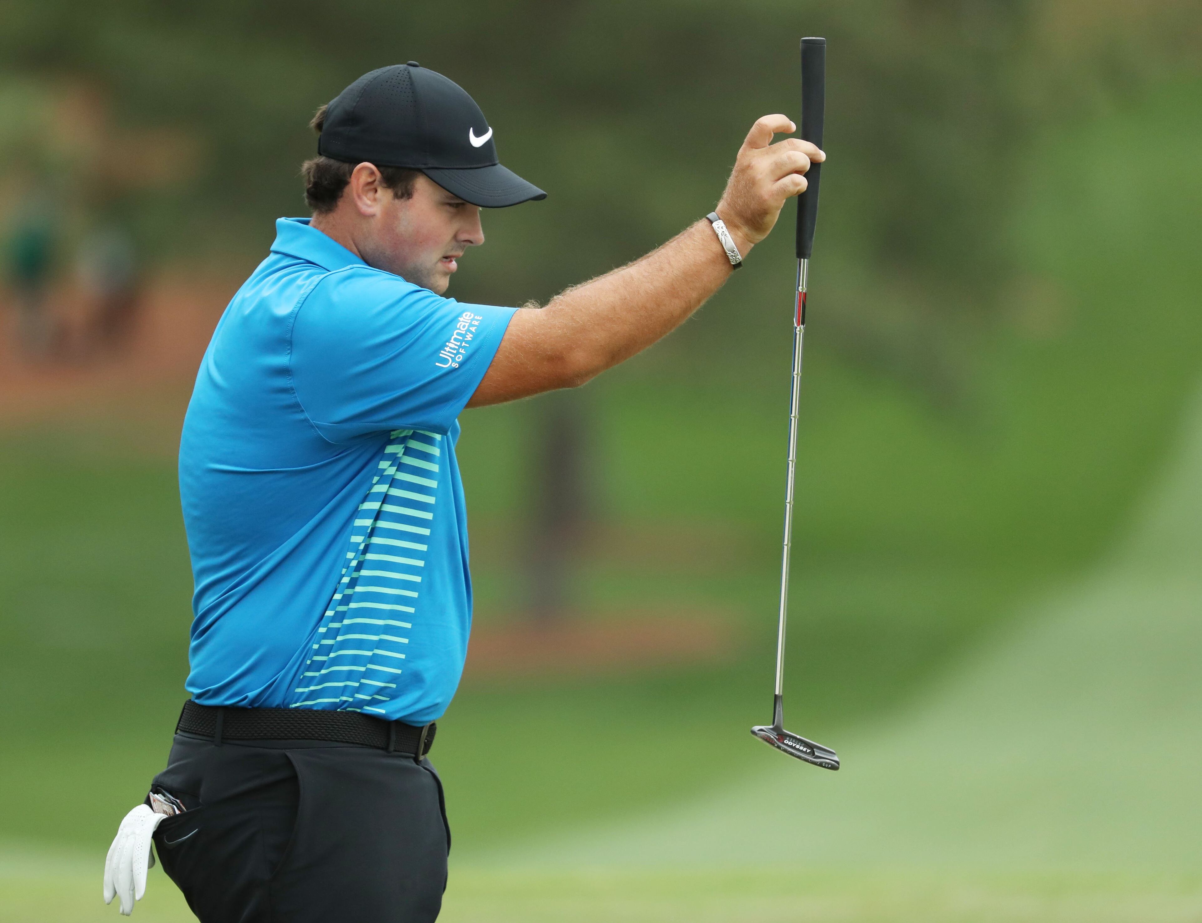 April 7, 2018 - Augusta, Ga: Patrick Reed lines up his putt on seven during the third round of the Masters Tournament Saturday, April 7, 2018, at Augusta National Golf Club. PHOTO / JASON GETZ