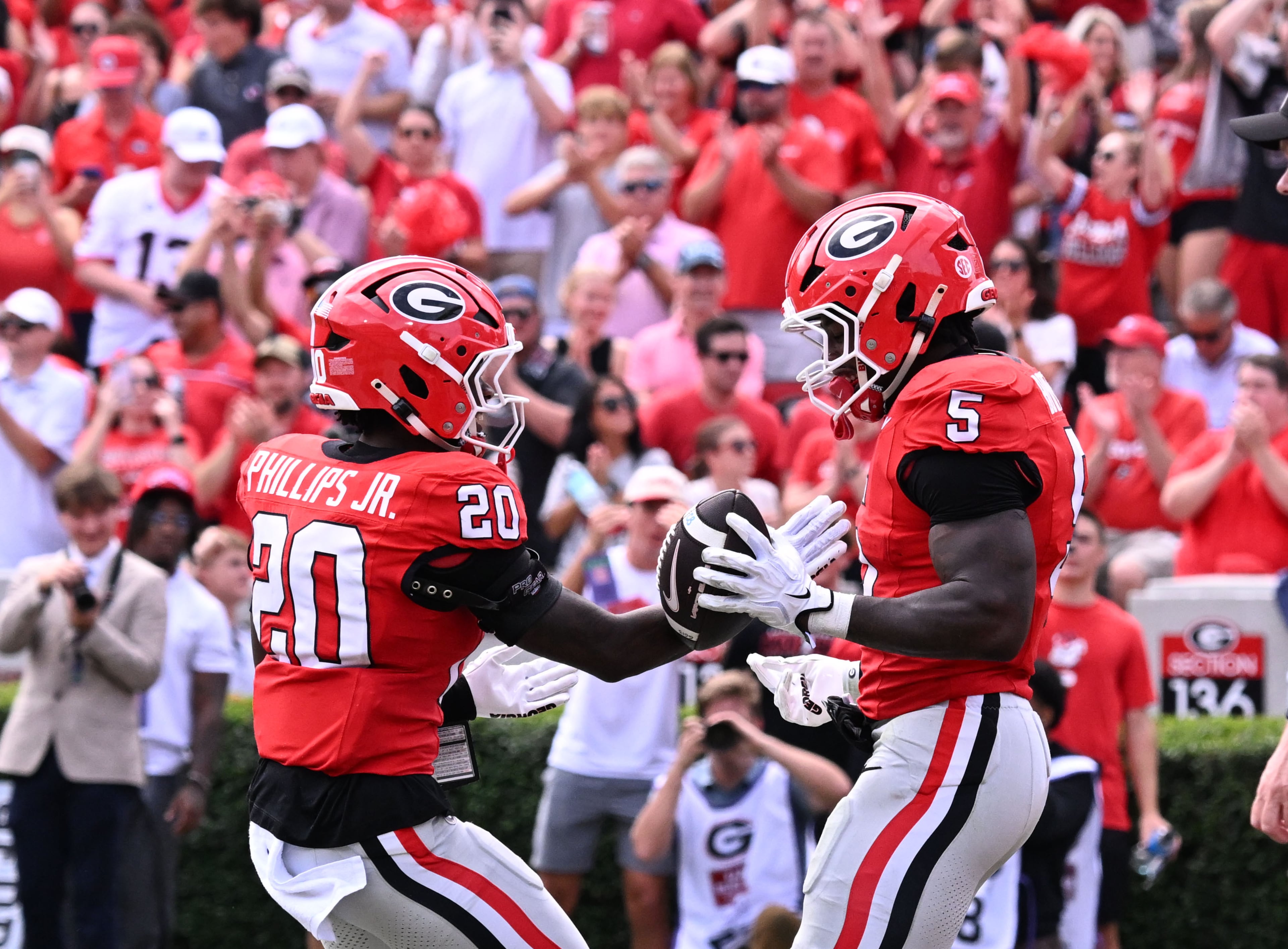 Georgia running back Chauncey Bowens (5) celebrates after scoring touchdown during the first half in an NCAA football game at Sanford Stadium on Saturday, Oct. 3, 2026, in Athens. (Hyosub Shin/AJC)
