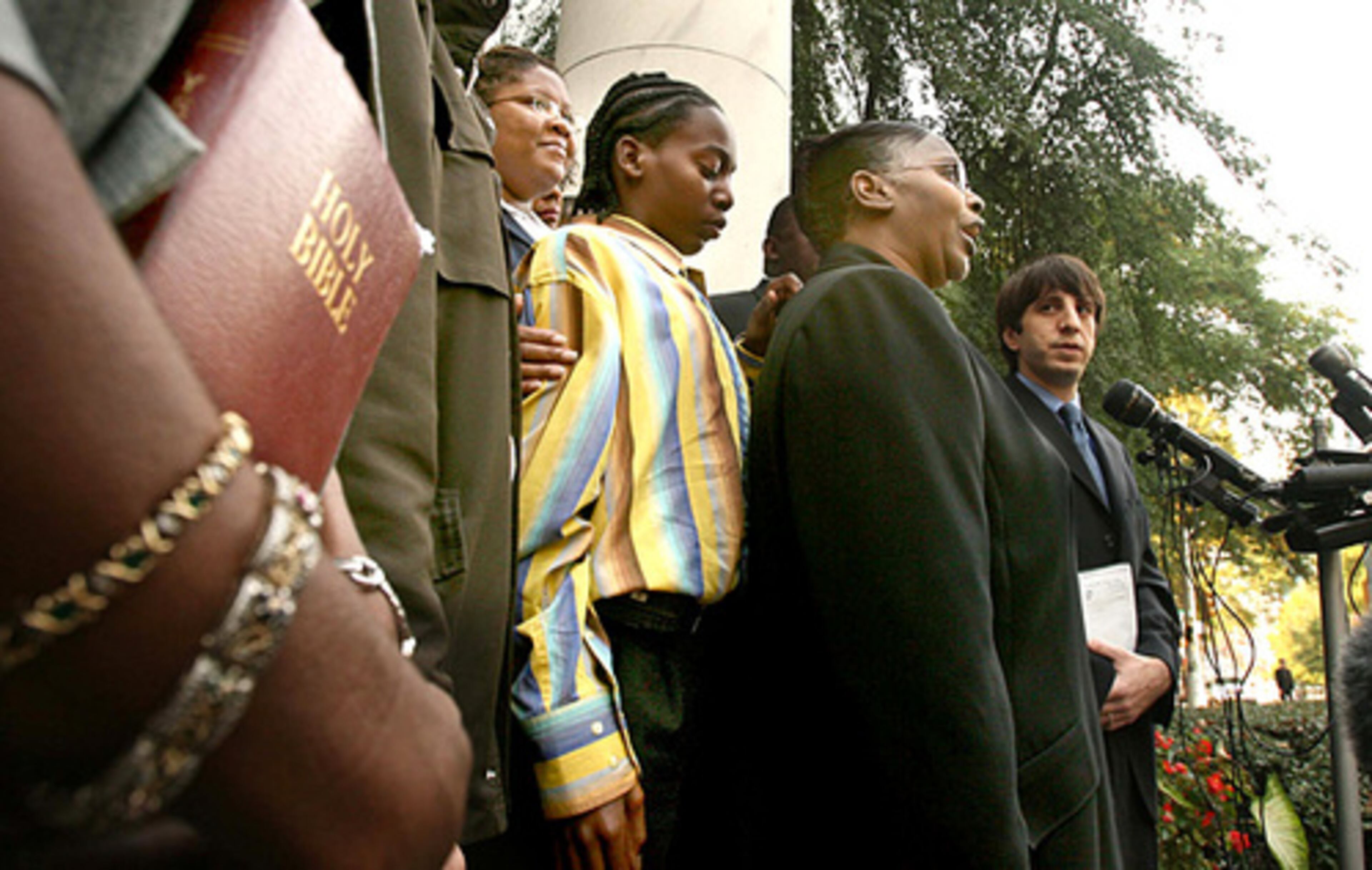 Troy Davis' mother, Virginia Davis, talks outside the courtroom. His sister, Martina Correia clutches a bible (left). "I want people to understand that justice for Troy is justice for Officer MacPhail and his family," Correia said.