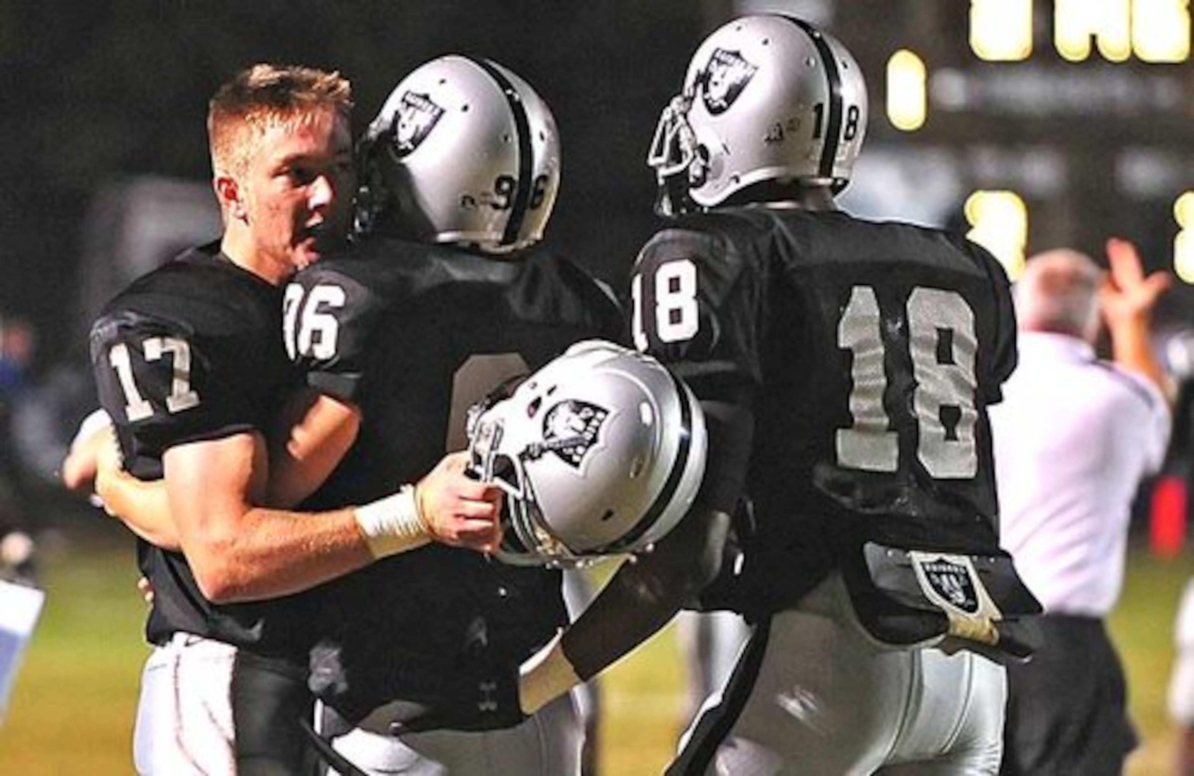 East Paulding Raiders QB Jesse Groover (17) celebrates with kicker Stephen Cummins after Cummins kicked the game winning field goal. East Paulding narrowly edged out Etowah 17-14.