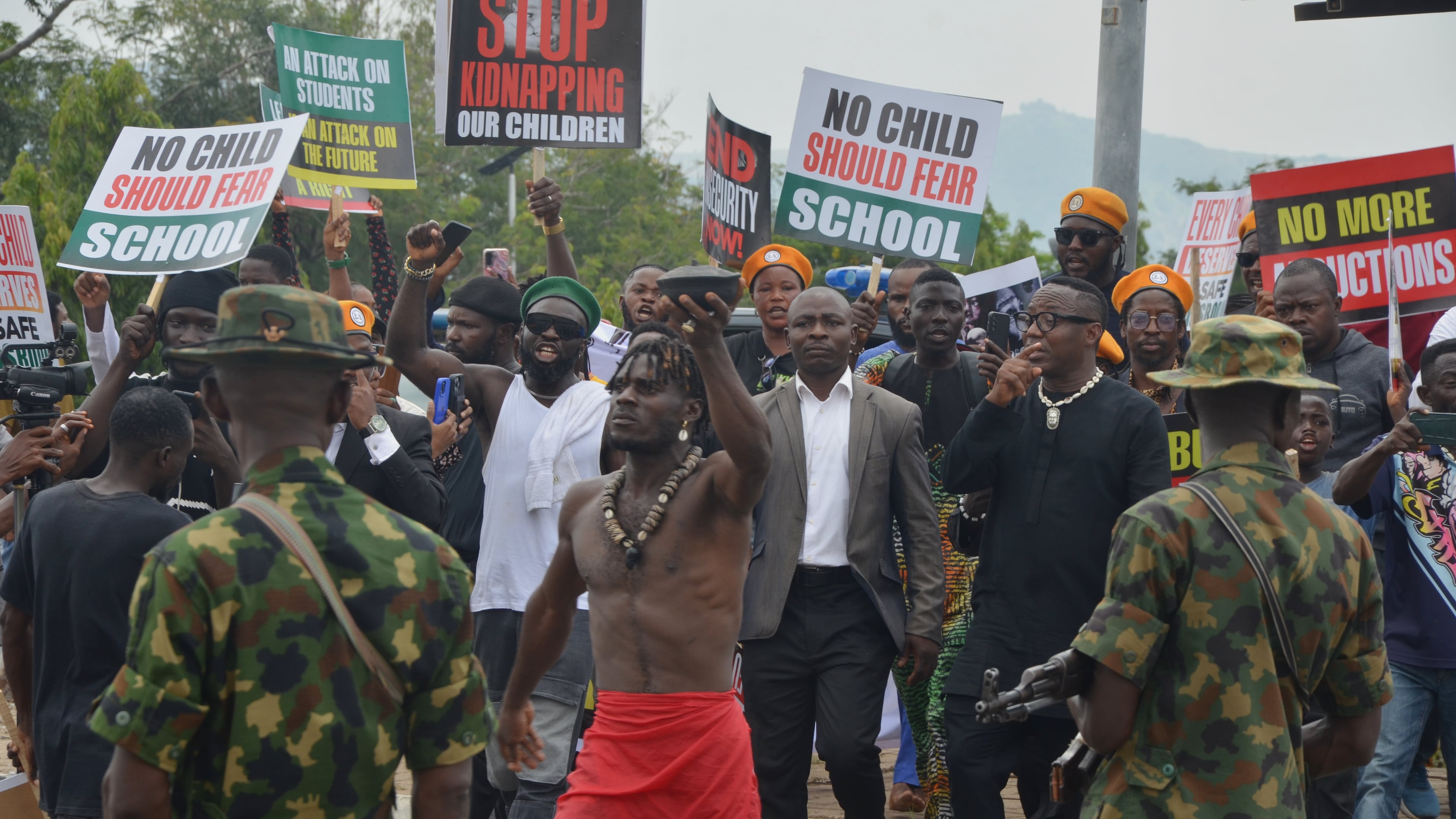 People protest demanding government to rescue the school children that were recently kidnapped in various part of the country, on the street of Abuja, Nigeria. Thursday, June 4, 2026. (AP Photo/Olamikan Gbemiga)