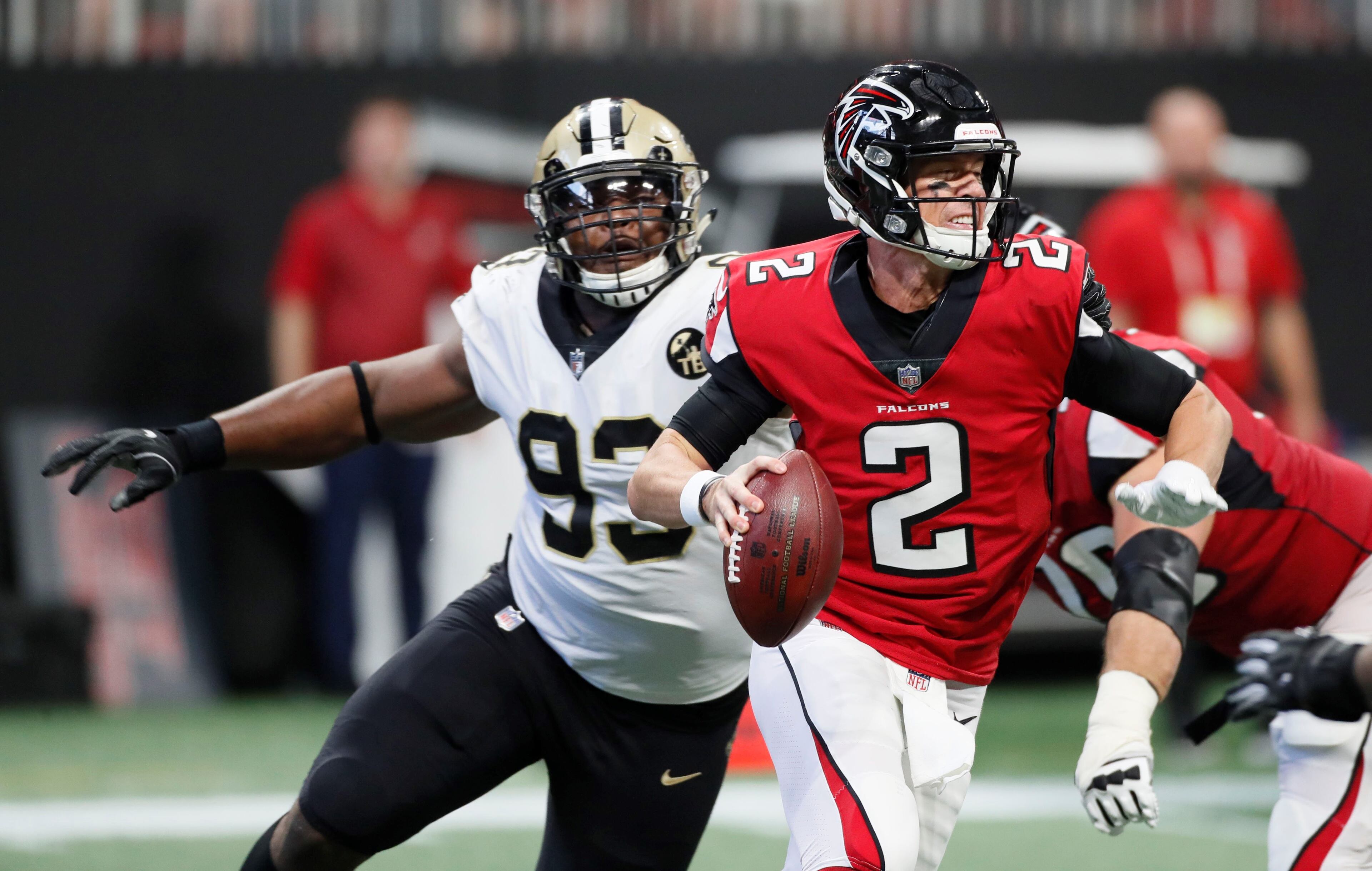 9/23/18 - Atlanta - Atlanta Falcons quarterback Matt Ryan (2) evades a Saint's rush and manages to throw the ball away in the first half. The Atlanta Falcons played the New Orleans Saints in an NFL football game Sunday, Sept 23, 2018, at Mercedes-Benz Stadium in Atlanta, GA. BOB ANDRES /BANDRES@AJC.COM
