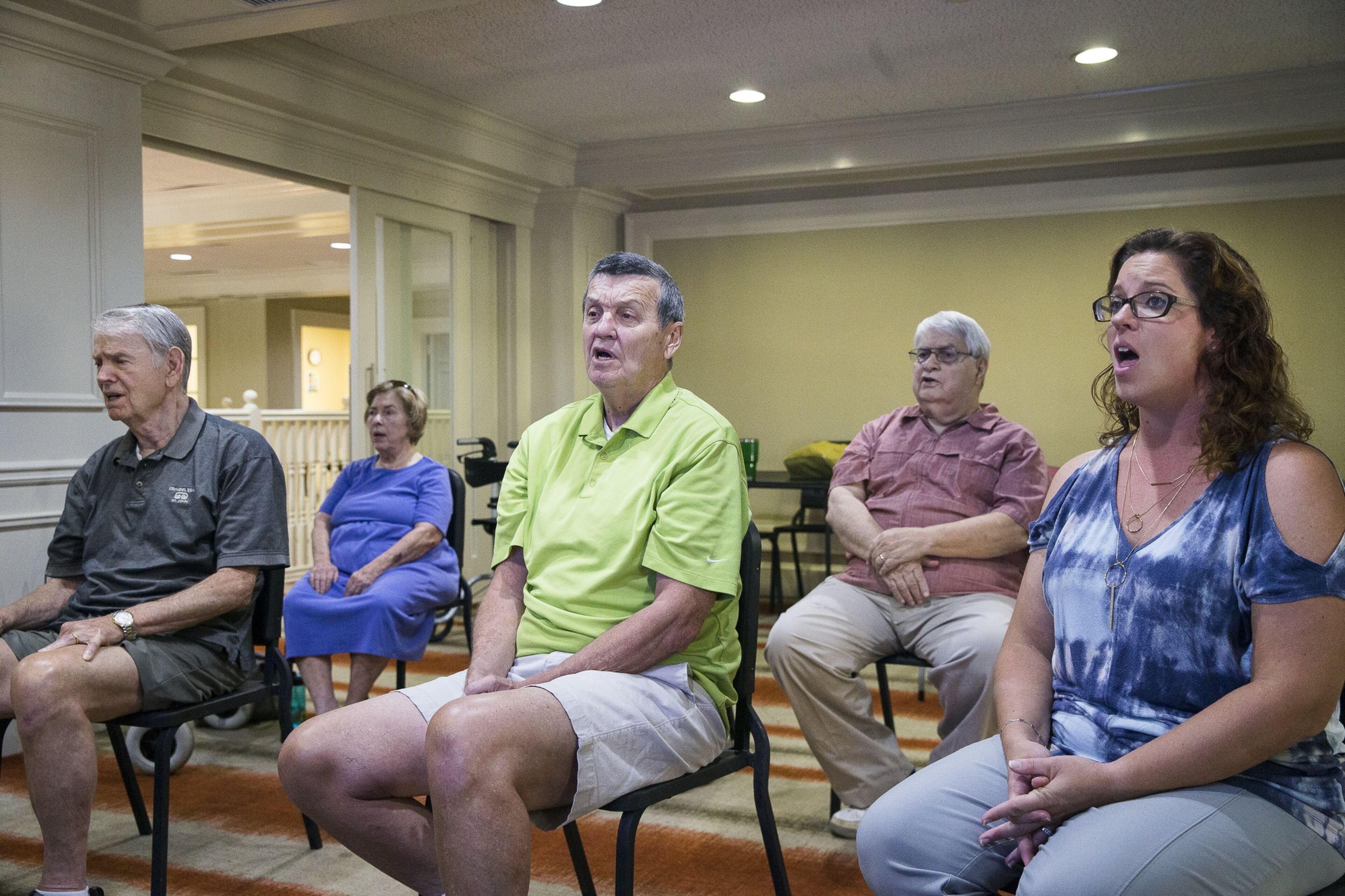 Members of the Singing with Parkinson’s choir rehearse “The Star-Spangled Banner.” The group will sing at “Parkinson’s Moving Day,” an annual fundraising event at Piedmont Park that raises awareness about Parkinson’s disease. ALYSSA POINTER / ALYSSA.POINTER@AJC.COM