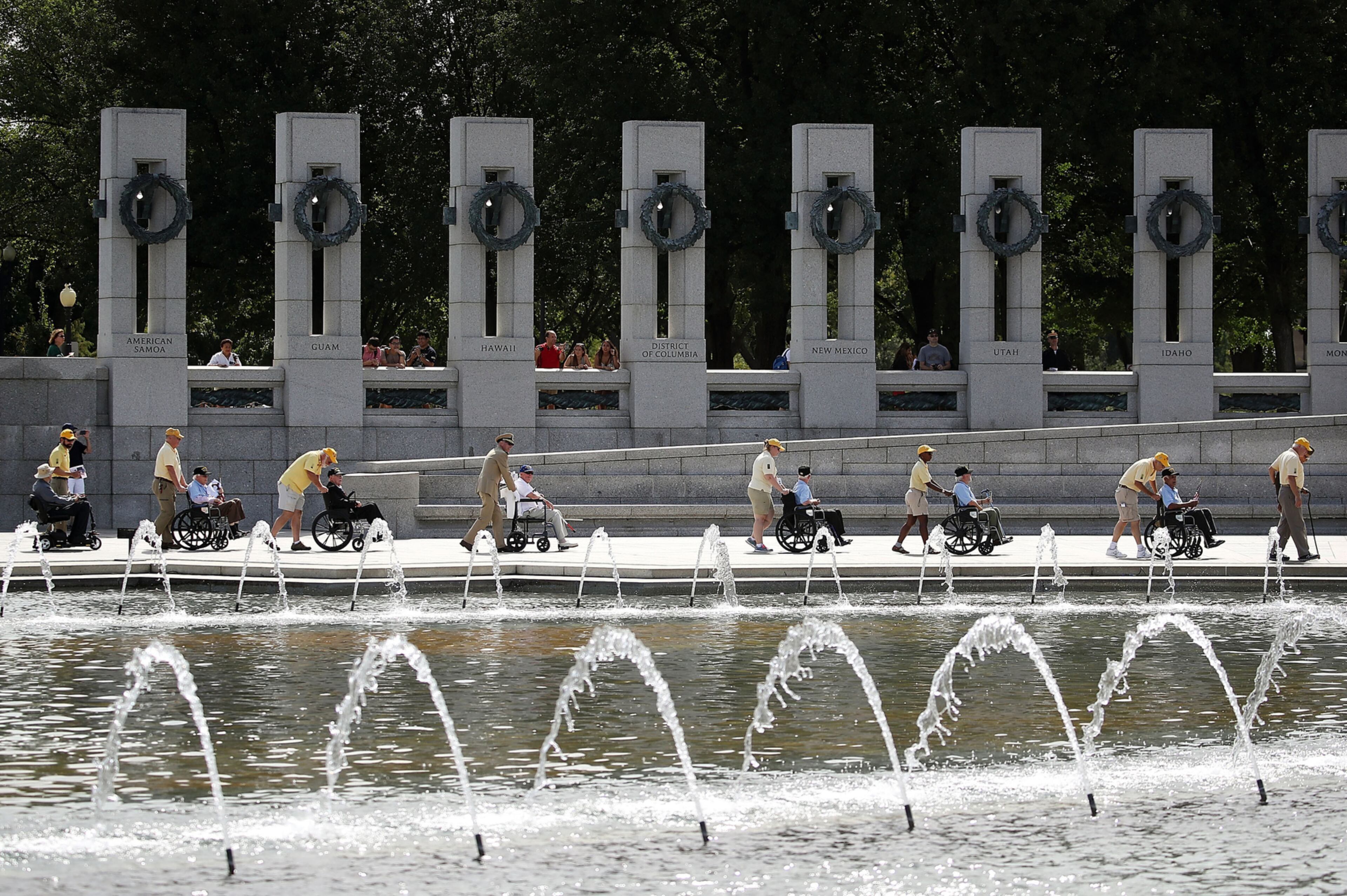 WASHINGTON, DC - SEPTEMBER 02: WWII veterans in wheel chairs are escorted during the annual V-J Day Observance to commemorate the Allied Forces victory in the Pacific and the end of World War II, at the World War II Memorial, on September 2, 2016 in Washington, DC. 71 years ago today Japan surrendered to allied forces, ending the war in the Pacific. (Photo by Mark Wilson/Getty Images) *** BESTPIX ***