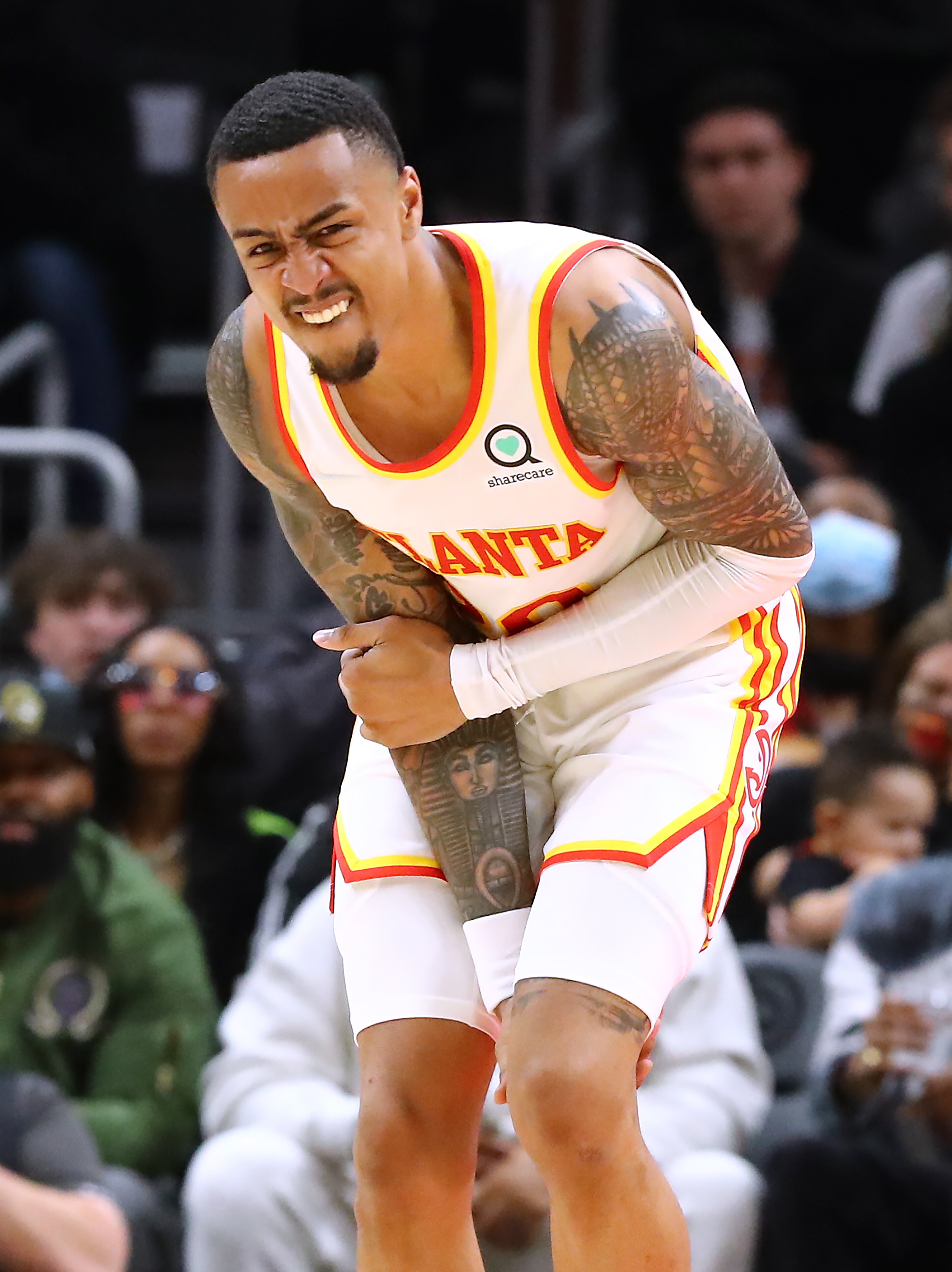 Hawks forward John Collins suffers an injury during the 4th period against the Phoenix Suns in a NBA basketball game on Thursday, Feb. 3, 2022, in Atlanta. “Curtis Compton / Curtis.Compton@ajc.com”`