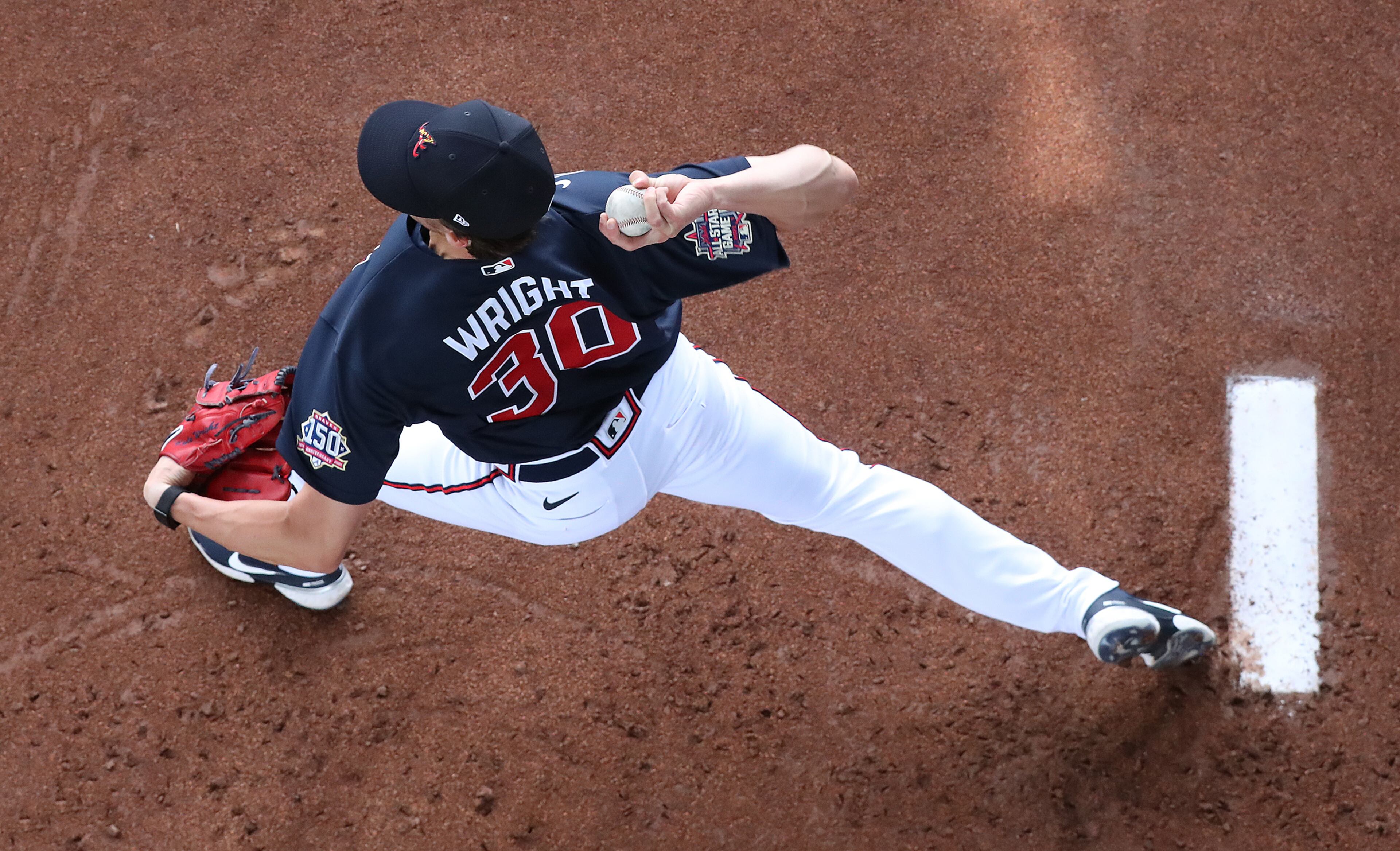 Atlanta Braves pitcher Kyle Wright loosens up in the bullpen preparing to throw live batting practice during spring training workout Wednesday, Feb. 24, 2021, at CoolToday Park in North Port, Fla. (Curtis Compton / Curtis.Compton@ajc.com)