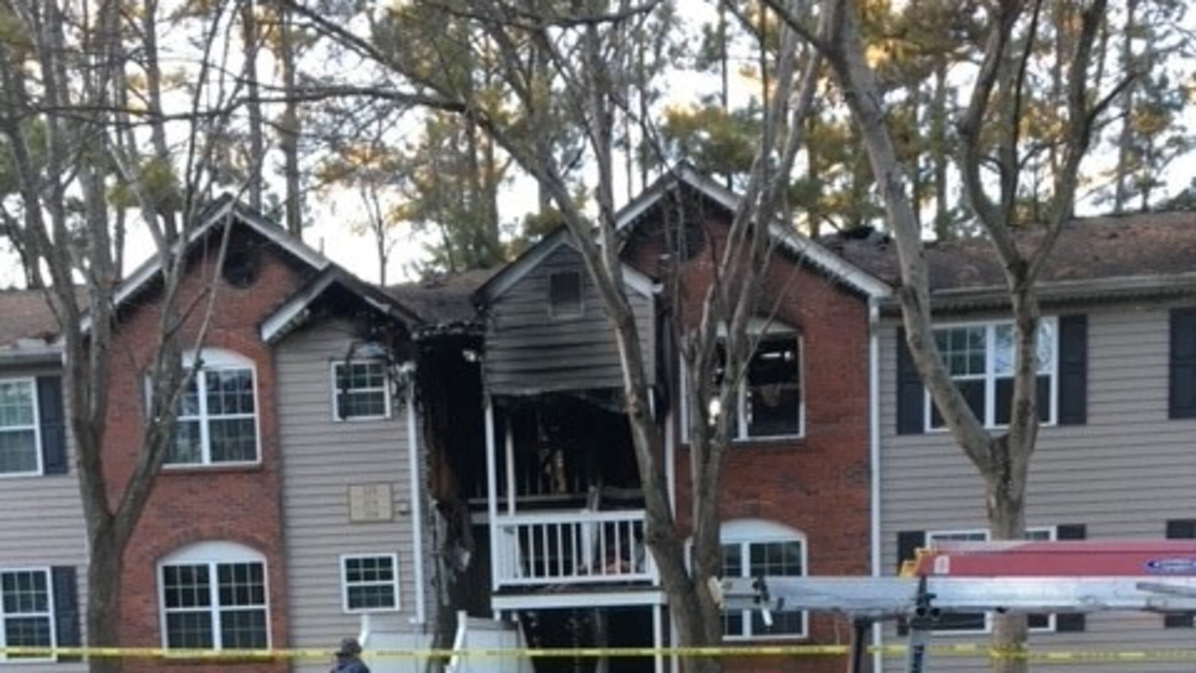 A fire destroyed the roof of an 18-unit condo complex in Roswell, displacing a dozen families.