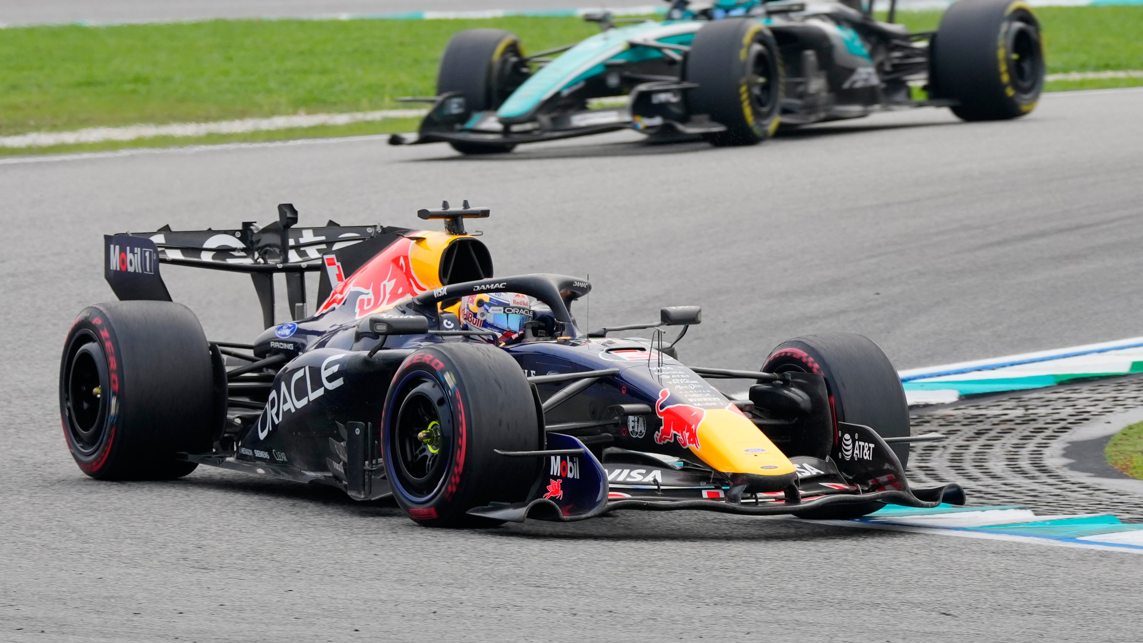 Red Bull driver Max Verstappen of the Netherlands steers his car ahead of Mercedes drivers George Russell of Britain during the Bahrain Grand Prix in Sepang, Malaysia, Sunday, Oct. 4, 2026. (AP Photo/Vincent Thian)