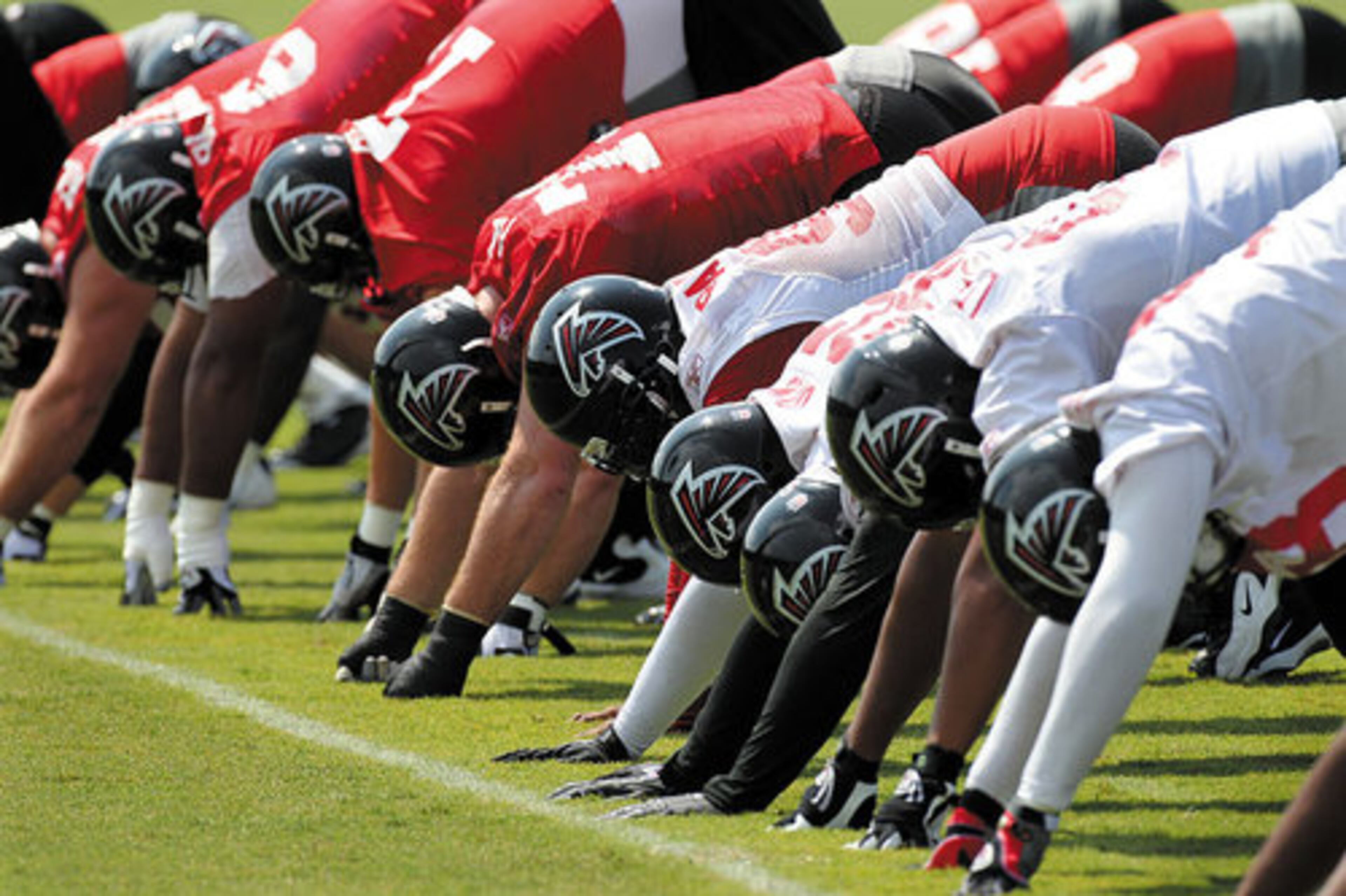 Players stretch during warmups.