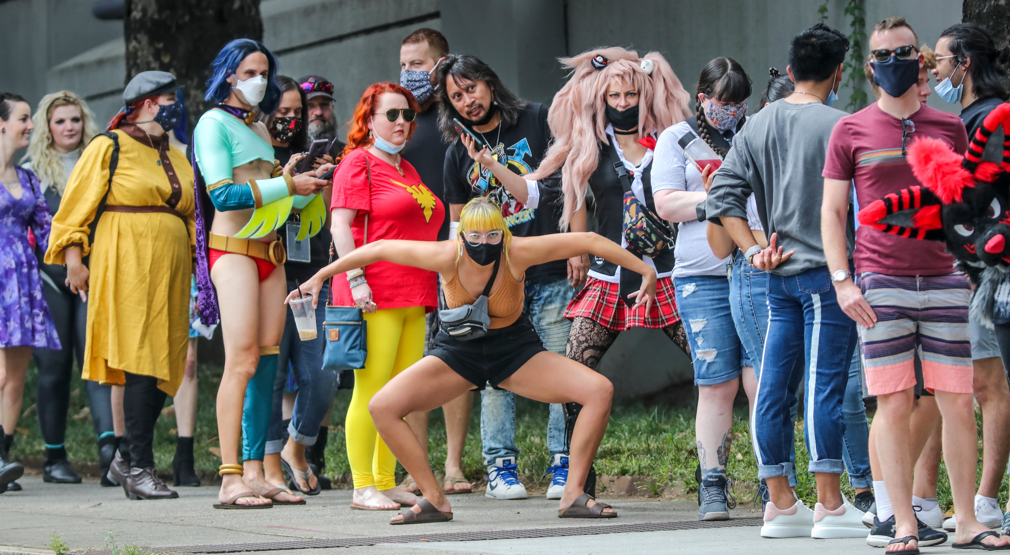 September 2, 2021 Atlanta: Drier air is filtering into North Georgia, lowering humidity and dropping temperatures as the Dragon Con crowd has arrived in Atlanta as hundreds lined up outside the Sheraton Atlanta Hotel at 165 Courtland Street in downtown Atlanta on Thursday, Sept. 2, 2021. An estimated 40,000 people are expected to show up over the five-day event running from Sept. 2 to 6. That is far below the 2019 attendance of 89,000, the most in the convention’s 34-year history. The 40,000 mark is closer to how many people showed up a decade ago. Panel rooms will be kept to two-thirds capacity and cleaned regularly. There will be plenty of celebrities on hand, “Star Trek” legend William Shatner tops the list. “Star Trek Discovery” and “Walking Dead” star Sonequa Martin-Green and “Shazam” lead Zachary Levi are scheduled to appear. So are “Battlestar Galactica” stars Edward James Olmos, Mary McDonnell and Tricia Helfer. Atlanta resident Louis Gossett Jr., a key part of HBO’s “Watchmen.” The Saturday morning parade that typically attracts thousands of non-convention viewers will be limited to only those viewers with a convention badge to watch from the sidewalks. Those with outdoor plans will be treated to “perfect weather conditions all the way through Saturday,” Channel 2 Action News meteorologist Eboni Deon said. (John Spink / John.Spink@ajc.com)