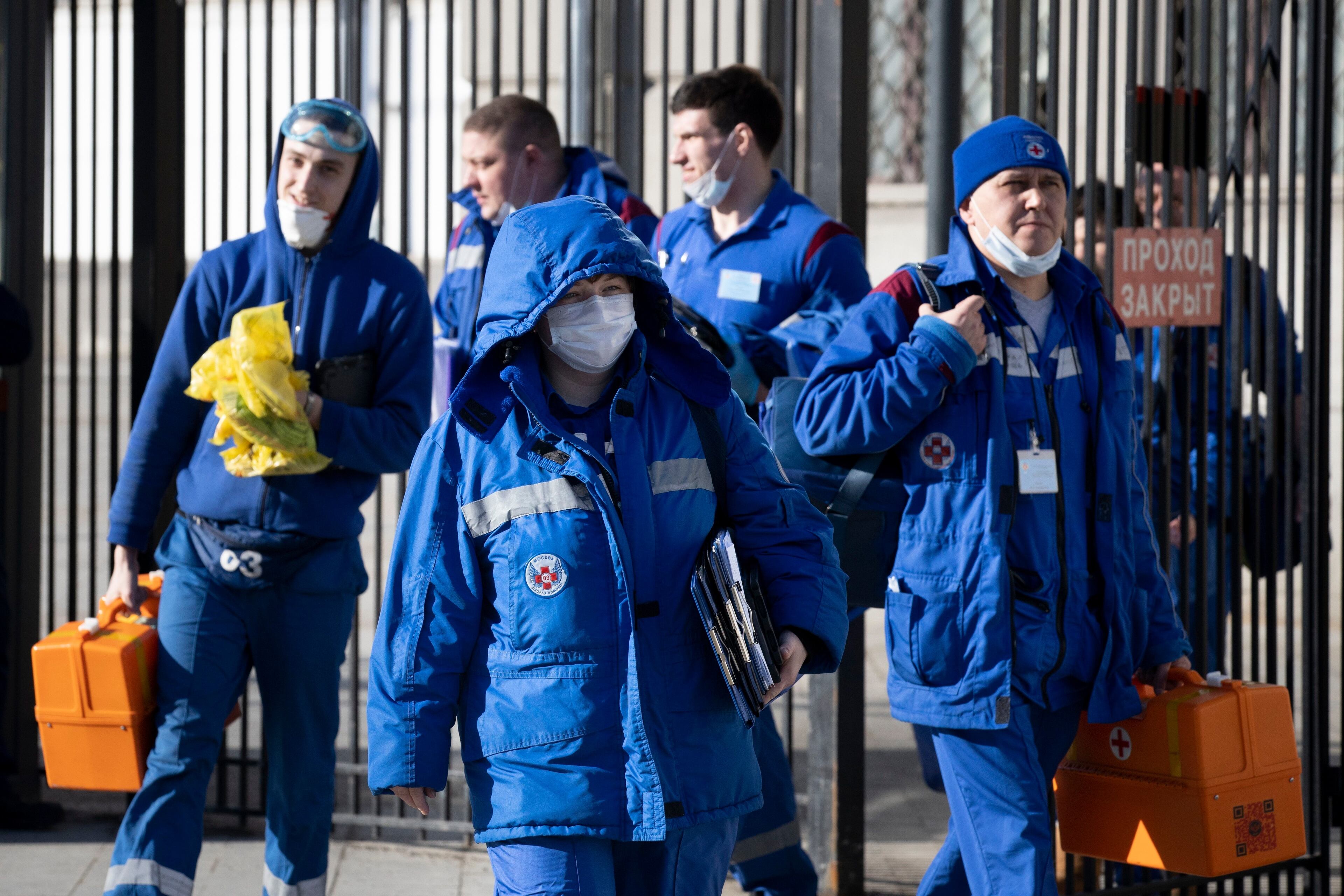 In this photo taken on Friday, Feb. 21, 2020, Medical workers walk after checking passengers where a passenger was identified with suspected coronavirus after arriving from Kyiv at Kievsky (Kyiv's) rail station in Moscow, Russia. Russia suspended all trains to China and North Korea, shut down its land border with China and Mongolia and extended a school vacation for Chinese students until March 1. Russian authorities are going to great lengths to prevent the new coronavirus from spreading in the capital and elsewhere.