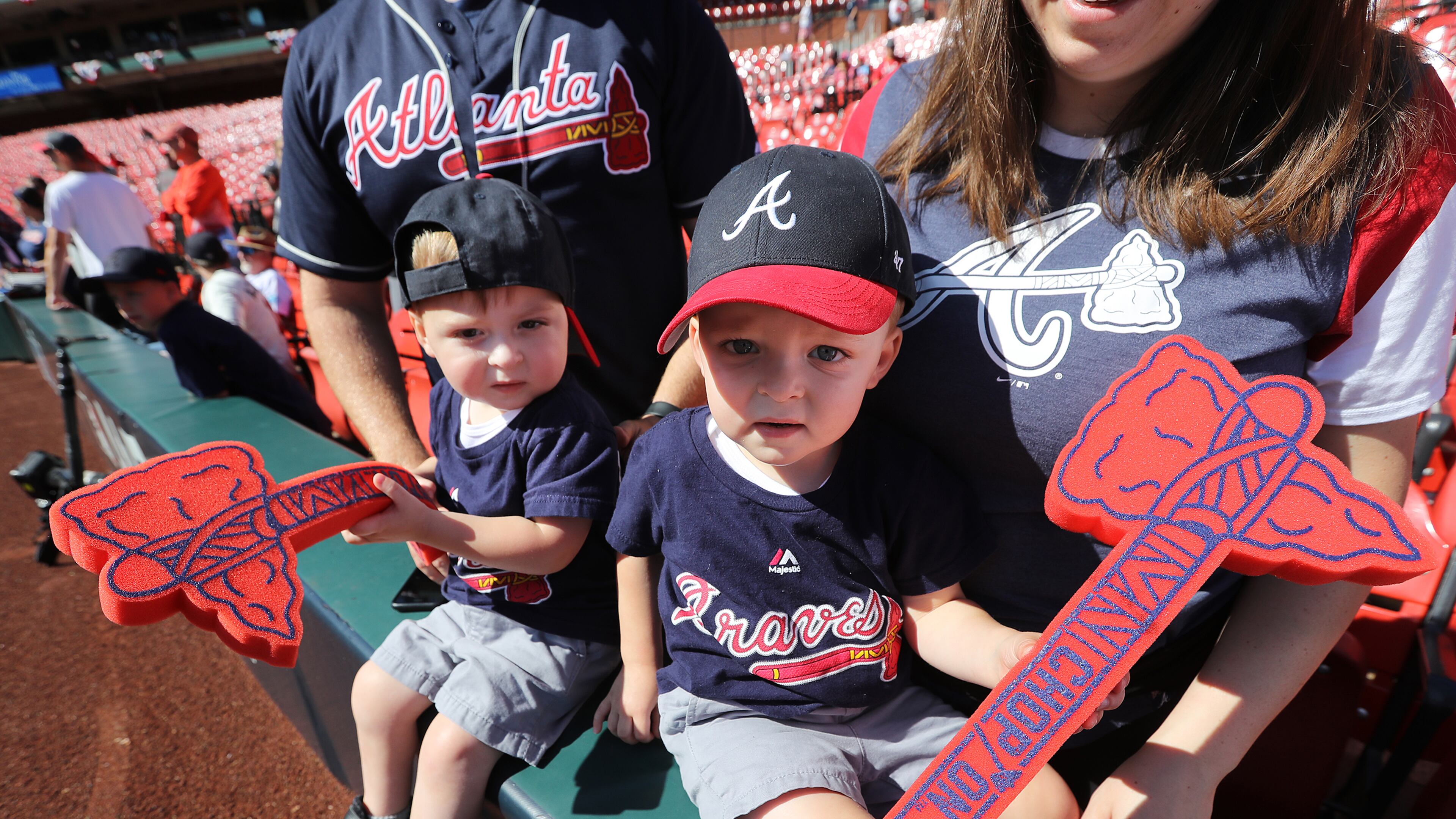 Fraternal twins Griffin (left) and Maddux Leseure, 2, are ready to cheer on the Braves while watching the team take batting practice before facing the Cardinals in Game 4 of the NLDS on Monday, October, 7, 2019, in St. Louis.