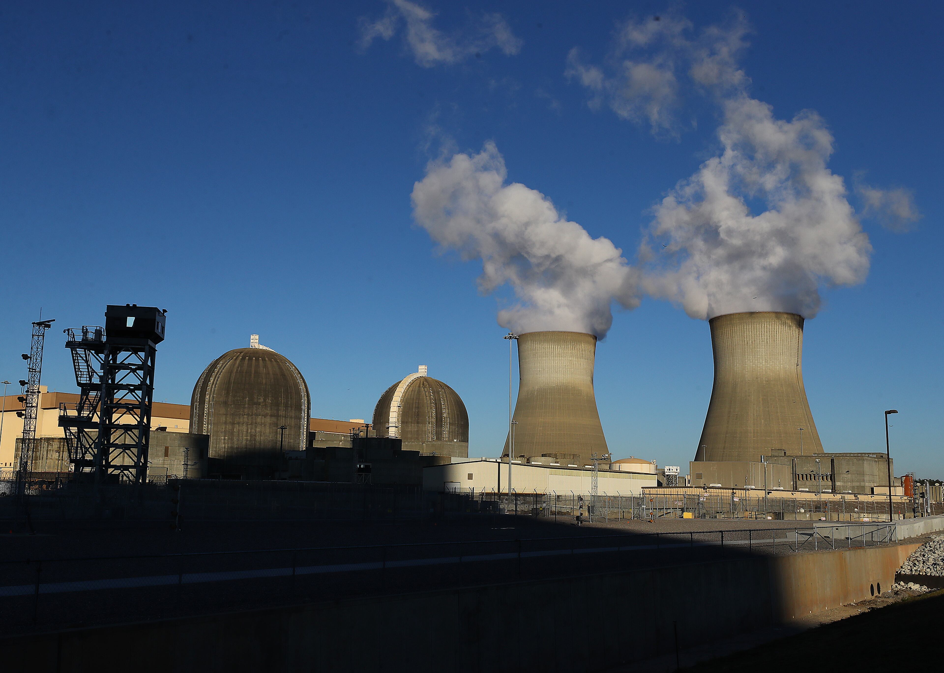 121421 Waynesboro: Containment vessels surround the existing site units 1 and 2 at Plant Vogtle beside their cooling towers on Tuesday, Dec 14, 2021, in Waynesboro. “Curtis Compton / Curtis.Compton@ajc.com”`