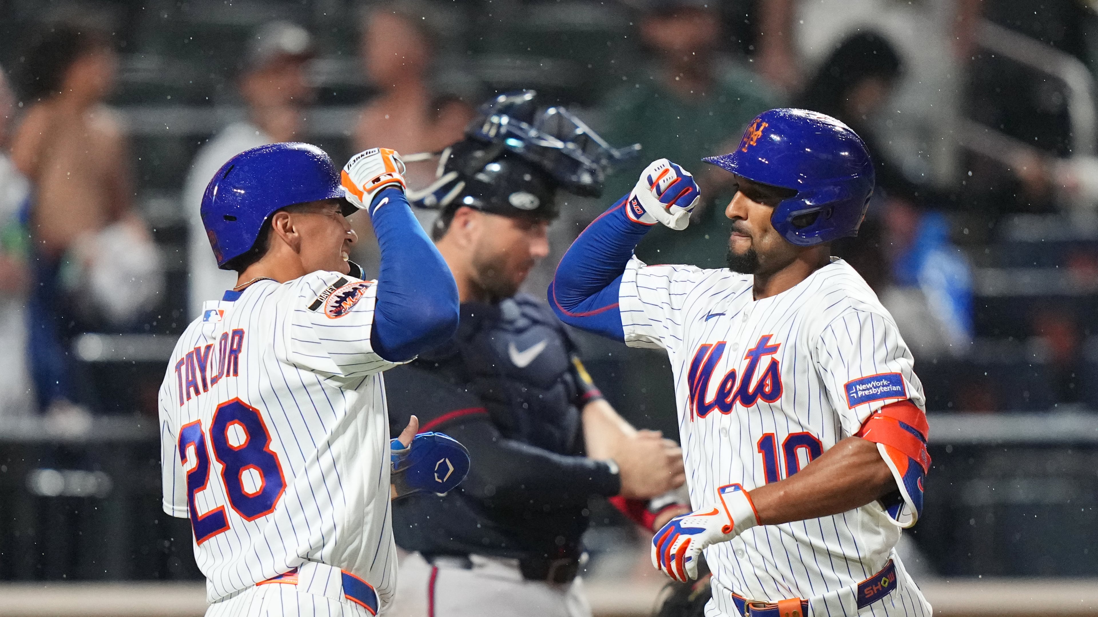 Mets center fielder Tyrone Taylor (left) celebrates with second baseman Marcus Semien after Semien hit a two-run home against the Braves on Monday, July 27, 2026, in New York. (Frank Franklin II/AP)