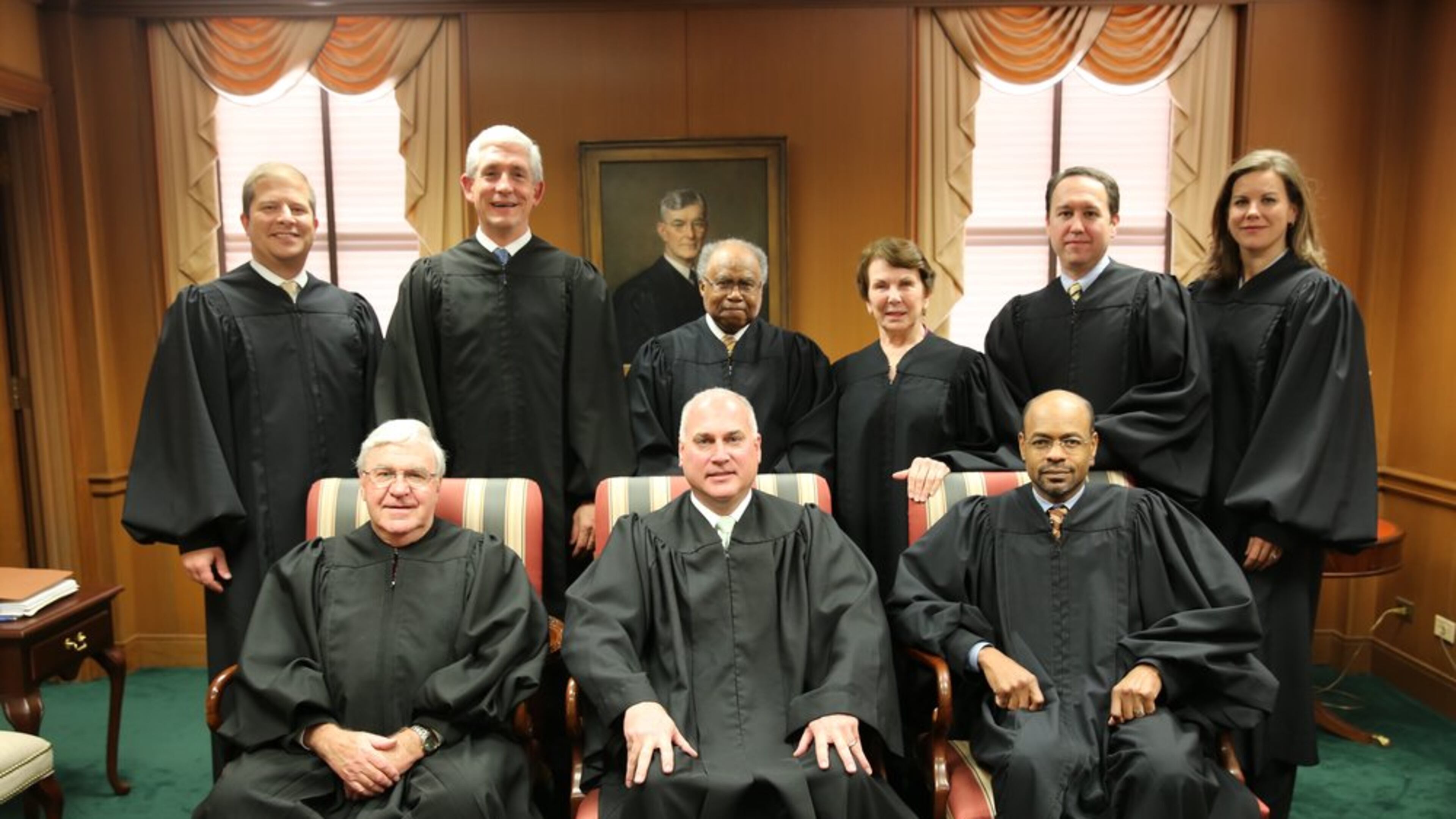Superior Court Judge Eric Norris (front row, center), when he sat as a visiting state Supreme Court justice because another justice had a conflict of interest. First row (from left to right): then-Chief Justice Harris Hines, Norris and former Justice Harold Melton. Back row (left to right): Justices Nels Peterson and David Nahmias and former Justices Robert Benham, Carol Hunstein, Keith Blackwell and Britt Grant. (Photo: Judgenorris.com)