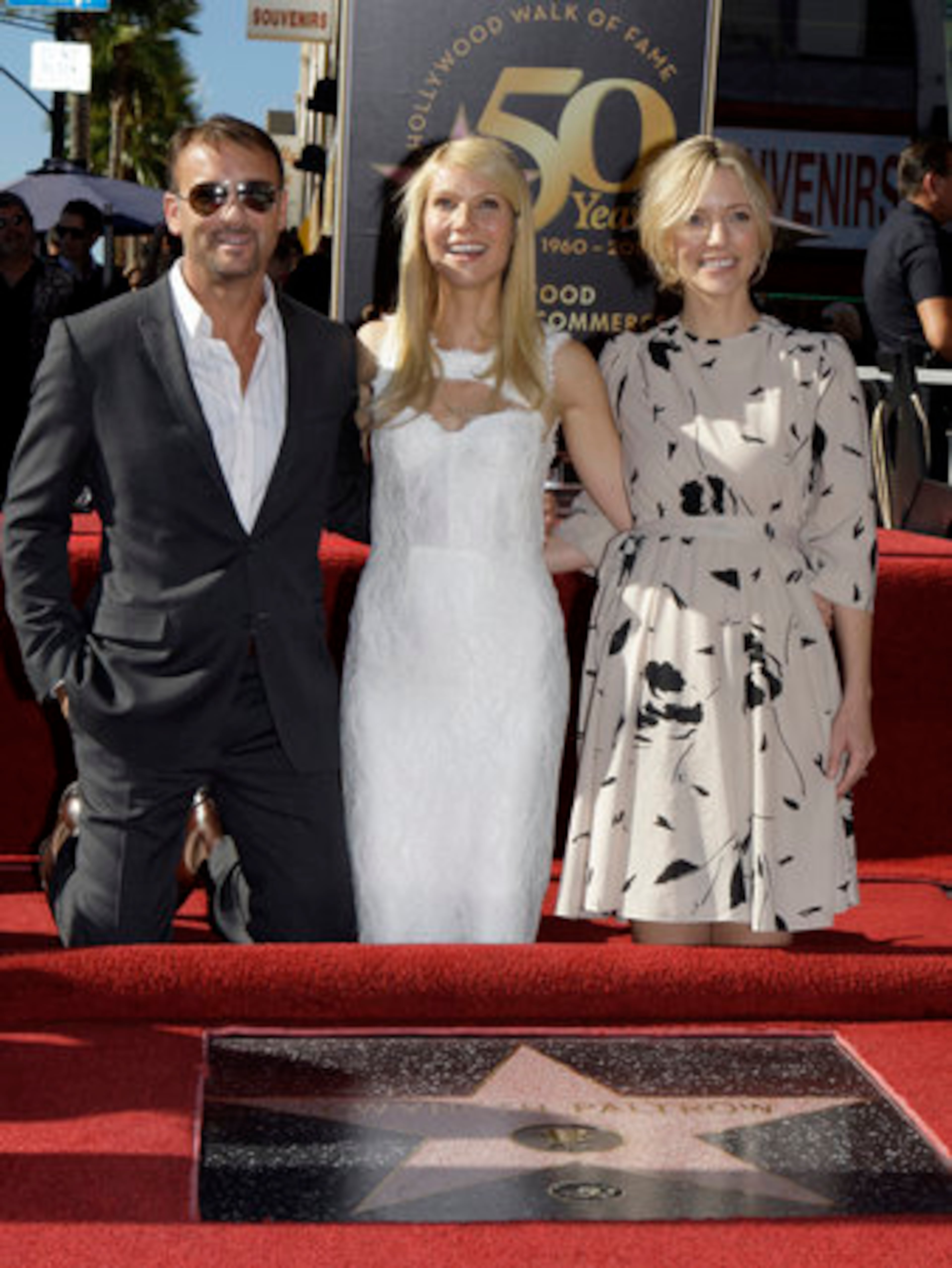 Actress Gwyneth Paltrow, center, poses with actor/singer Tim Mc Graw and director Shana Feste during dedication ceremonies for her star on the Hollywood Walk of Fame in Los Angeles Monday, Dec. 13, 2010. Paltrow and McGraw star and Feste directs the upcoming film, "Country Strong, " due out in January.