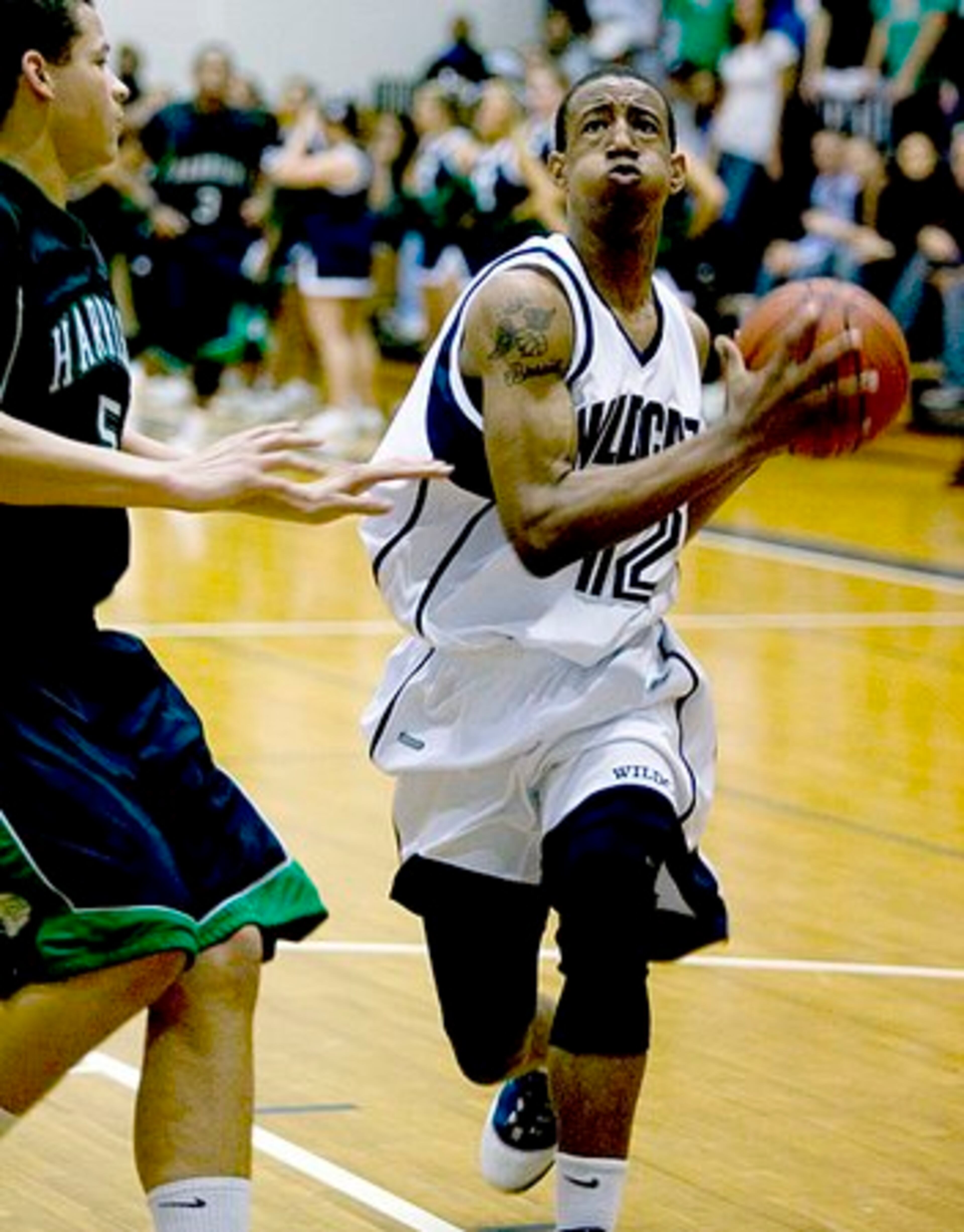 Wheeler's Tahj Tate drives the lane. Wheeler won its first round Class AAAAA match up against Wheeler 84-66 Saturday in Marietta.