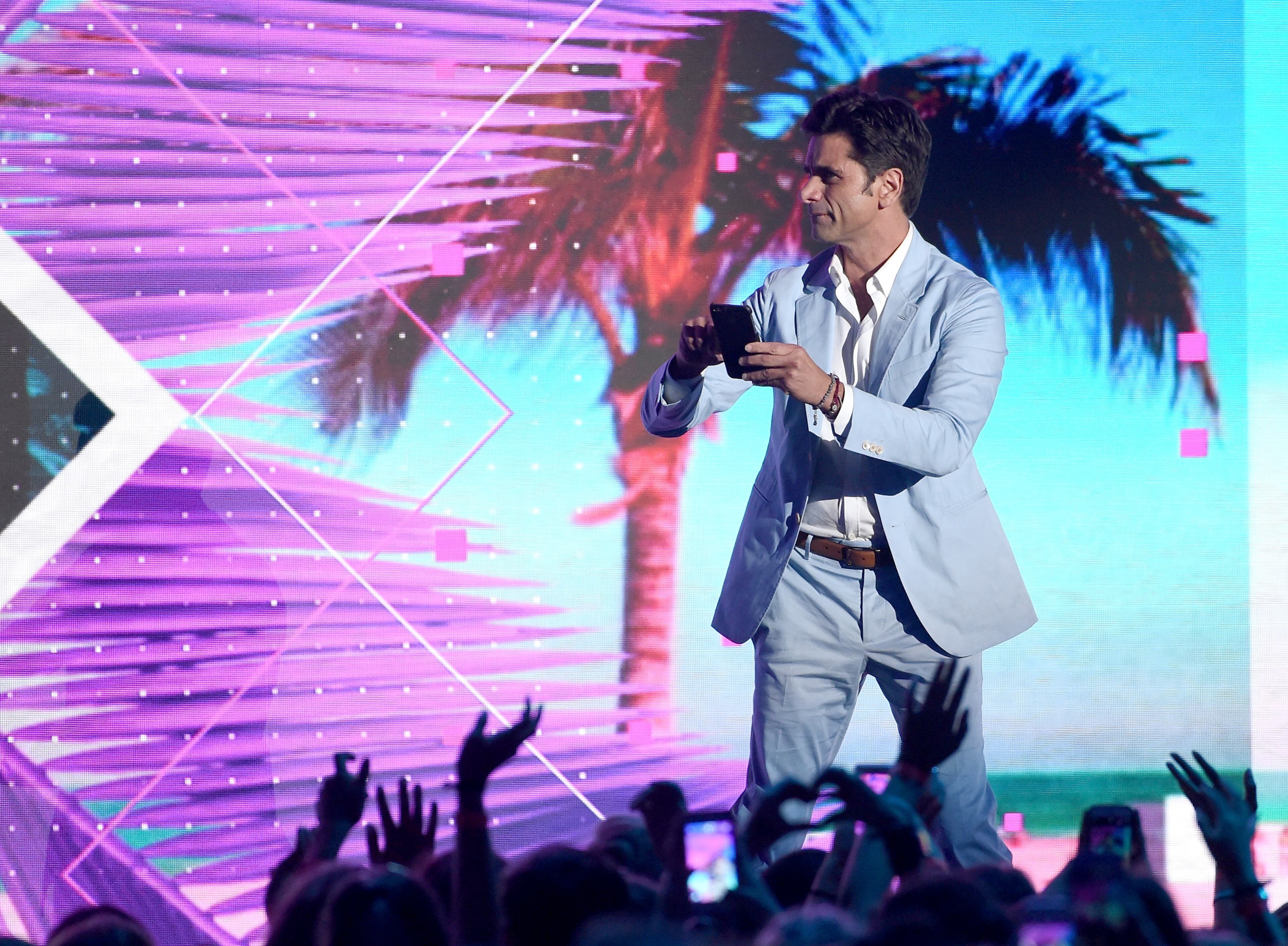 INGLEWOOD, CA - JULY 31: Actor John Stamos speaks onstage during Teen Choice Awards 2016 at The Forum on July 31, 2016 in Inglewood, California. (Photo by Kevin Winter/Getty Images)