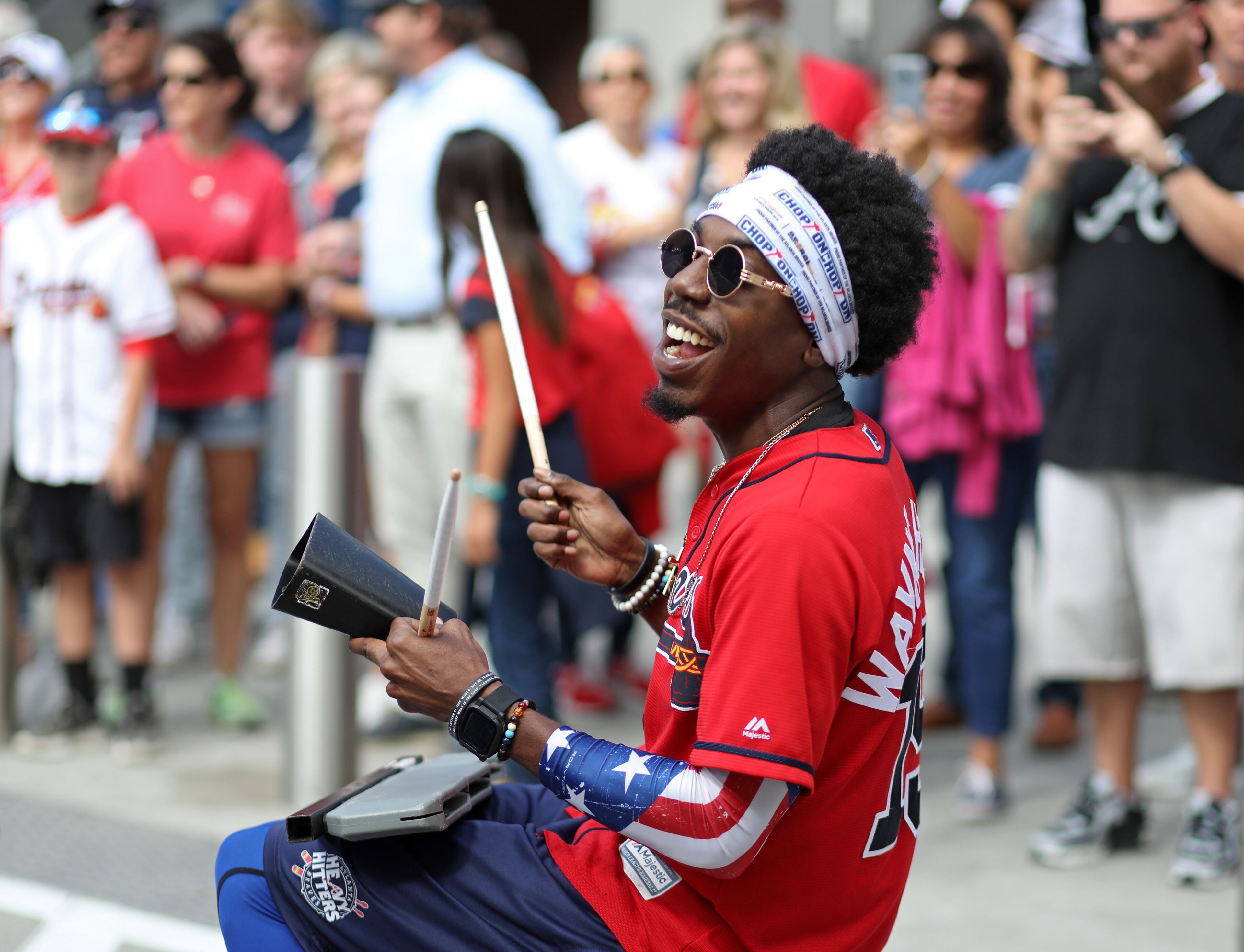A member of the Atlanta Braves' Heavy Hitters drumline performs in The Battery Atlanta. (JASON GETZ/SPECIAL TO THE AJC)