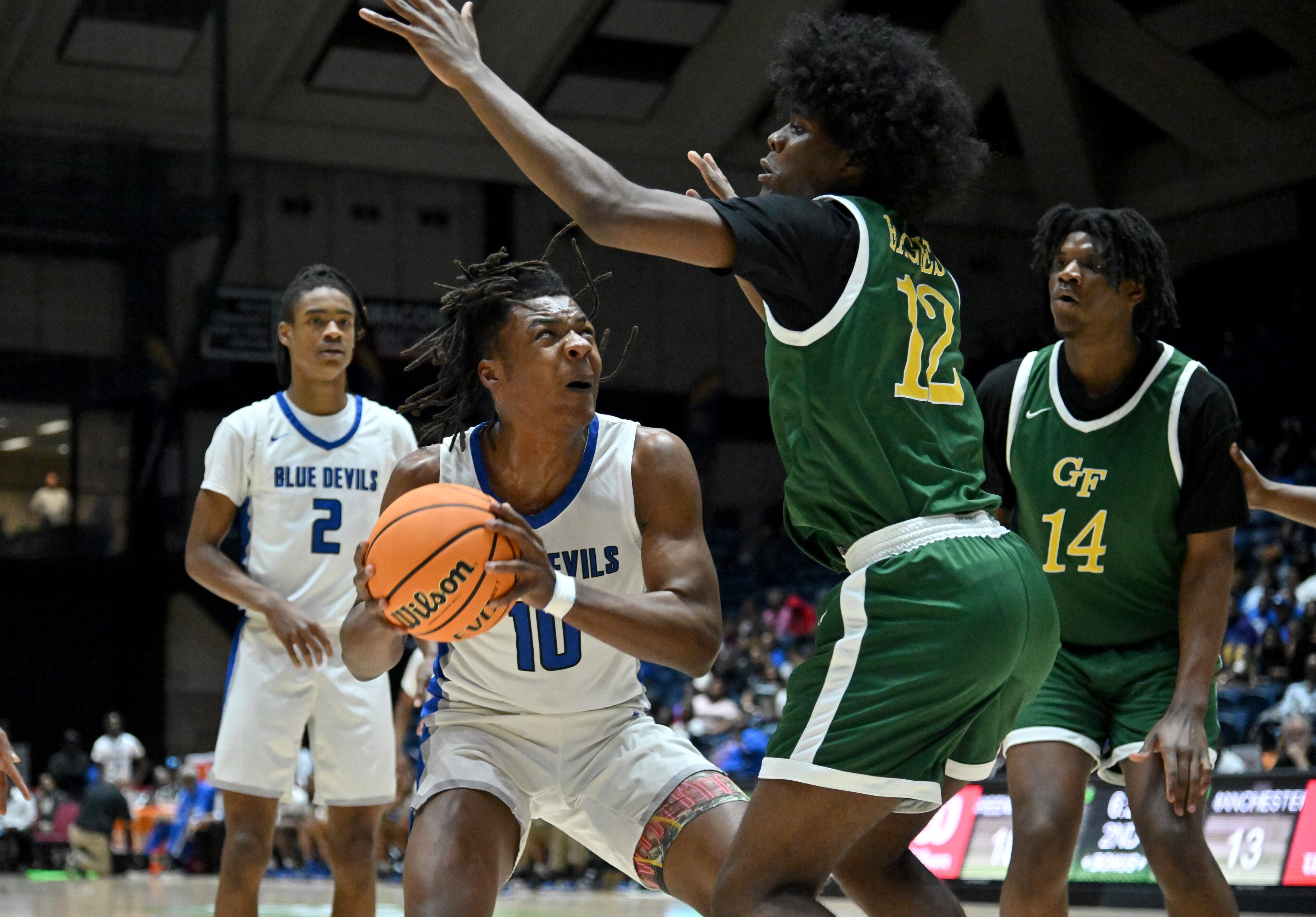 Manchester's Jhi Terry (10) prepares to shoot against Greenforest’s Orion Wilson (12) during the first half of GHSA Basketball Class A Division II Boy’s State Championship game at the Macon Centreplex, Wednesday, Mar. 6, 2024, in Macon. (Hyosub Shin / Hyosub.Shin@ajc.com)