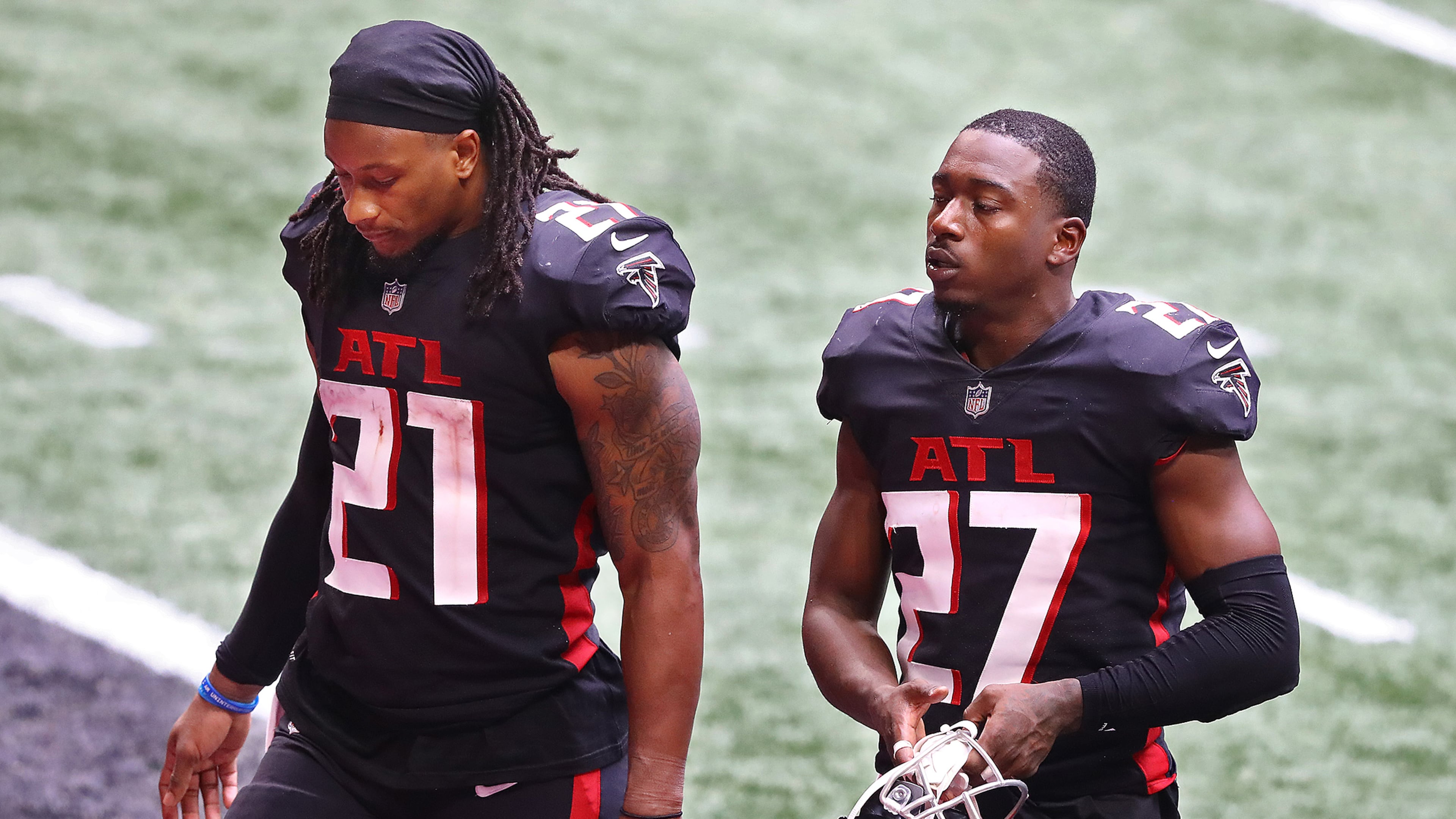 Atlanta Falcons running back Todd Gurley, 21, and Damontae Kazee, 27, walk off the field after falling 30-26 to the Chicago Bears in an NFL football game on Sunday, Sept. 27, 2020 in Atlanta, GA. (Curtis Compton/Atlanta Journal-Constitution/TNS)