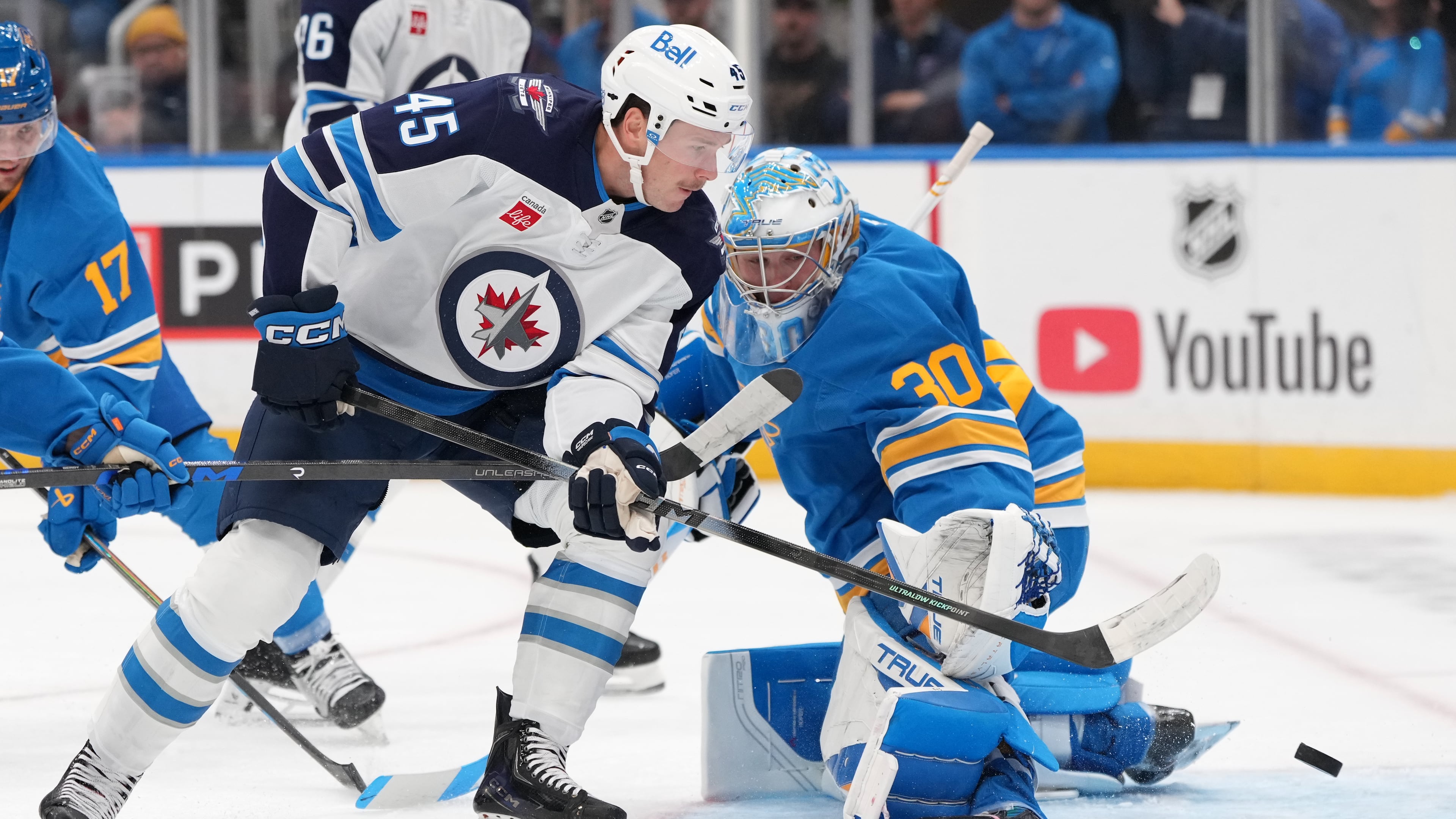 Winnipeg Jets' Cole Koepke (45) is unable to score past St. Louis Blues goaltender Joel Hofer (30) during the first period of an NHL hockey game Tuesday, Oct. 20, 2026, in St. Louis. (AP Photo/Jeff Roberson)