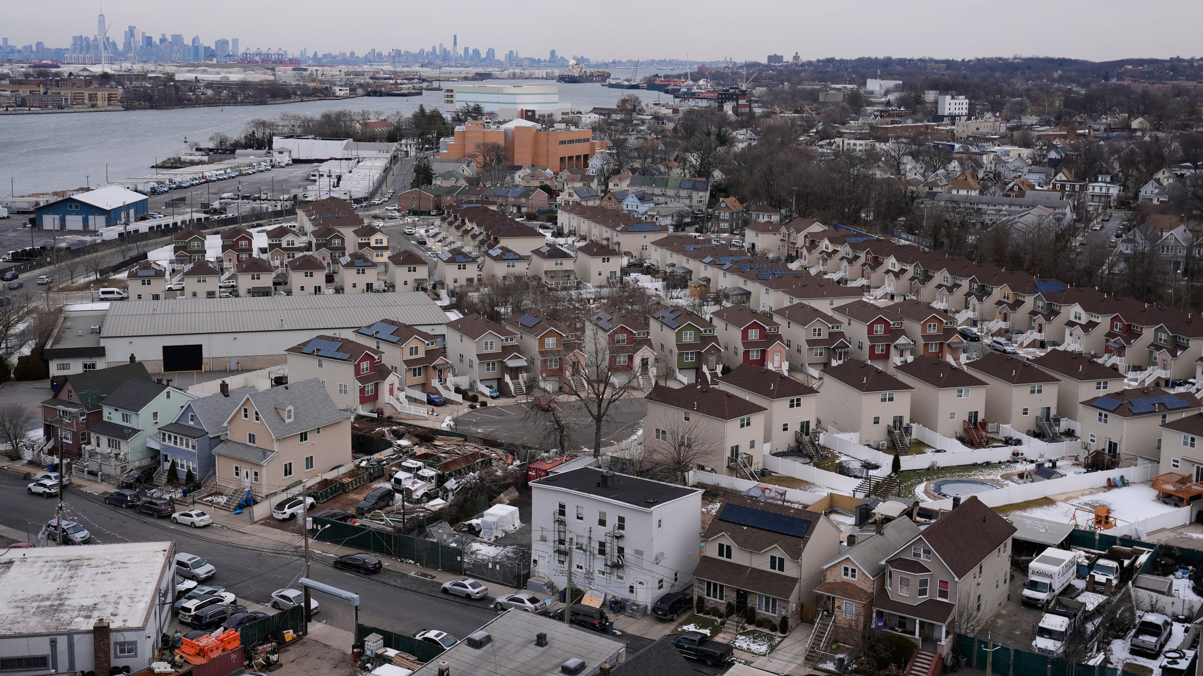 The skyline of lower Manhattan, top left, is seen behind the Staten Island borough of New York, Friday, Jan. 23, 2026. (AP Photo/Seth Wenig)