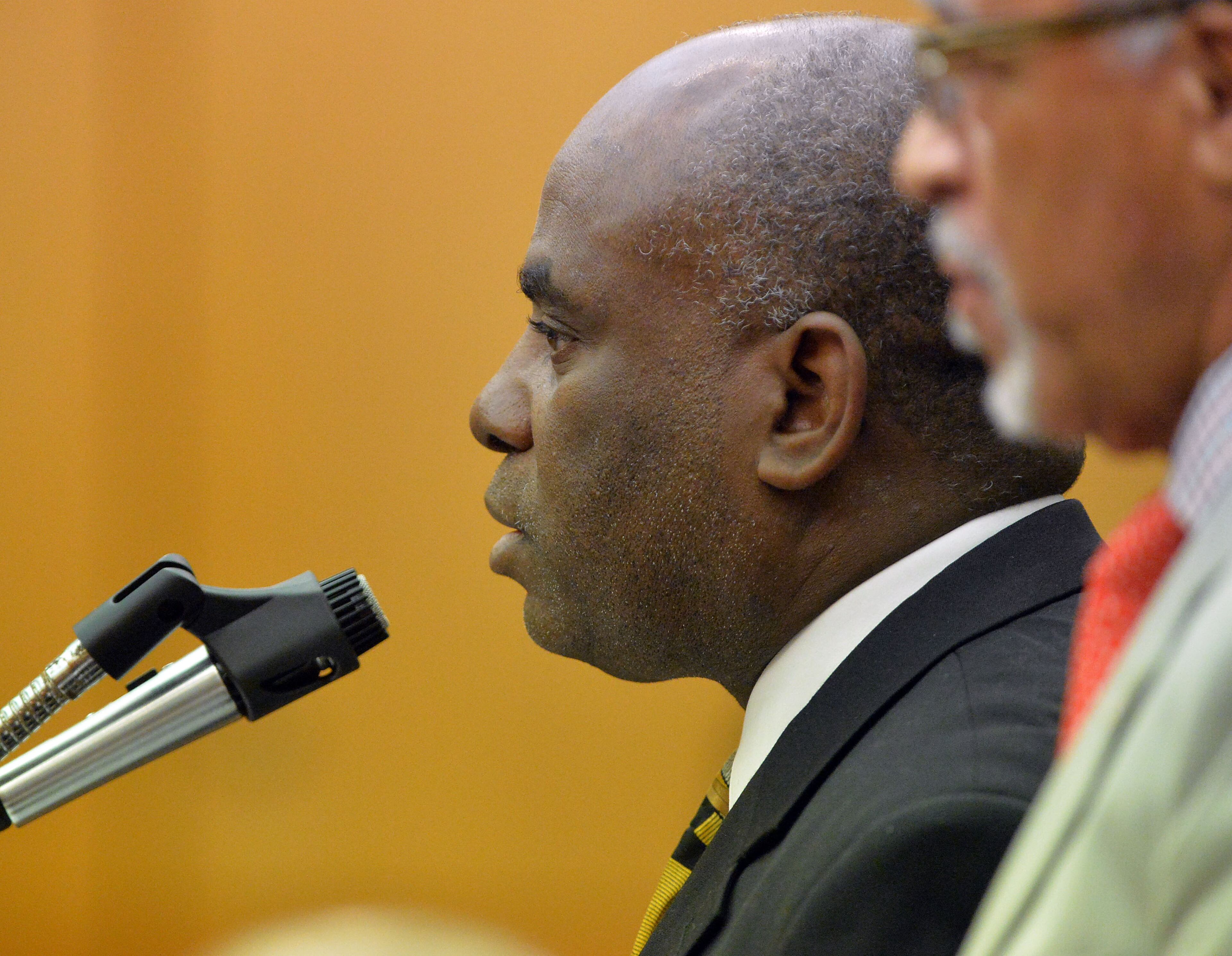 Former APS Usher Collier Heights Elem testing coordinator Donald Bullock takes a sentencing deal and accepts responsibility for his actions before being sentenced to 5 years probation, 6months of jail on weekends, 1500 hours of community service and a $5000 fine. Sentencing continues for 10 of the 11 defendants convicted of racketeering and other charges in the Atlanta Public Schools test-cheating trial before Judge Jerry Baxter in Fulton County Superior Court, Tuesday, April 14, 2015. (Atlanta Journal-Constitution, Kent D. Johnson, Pool)